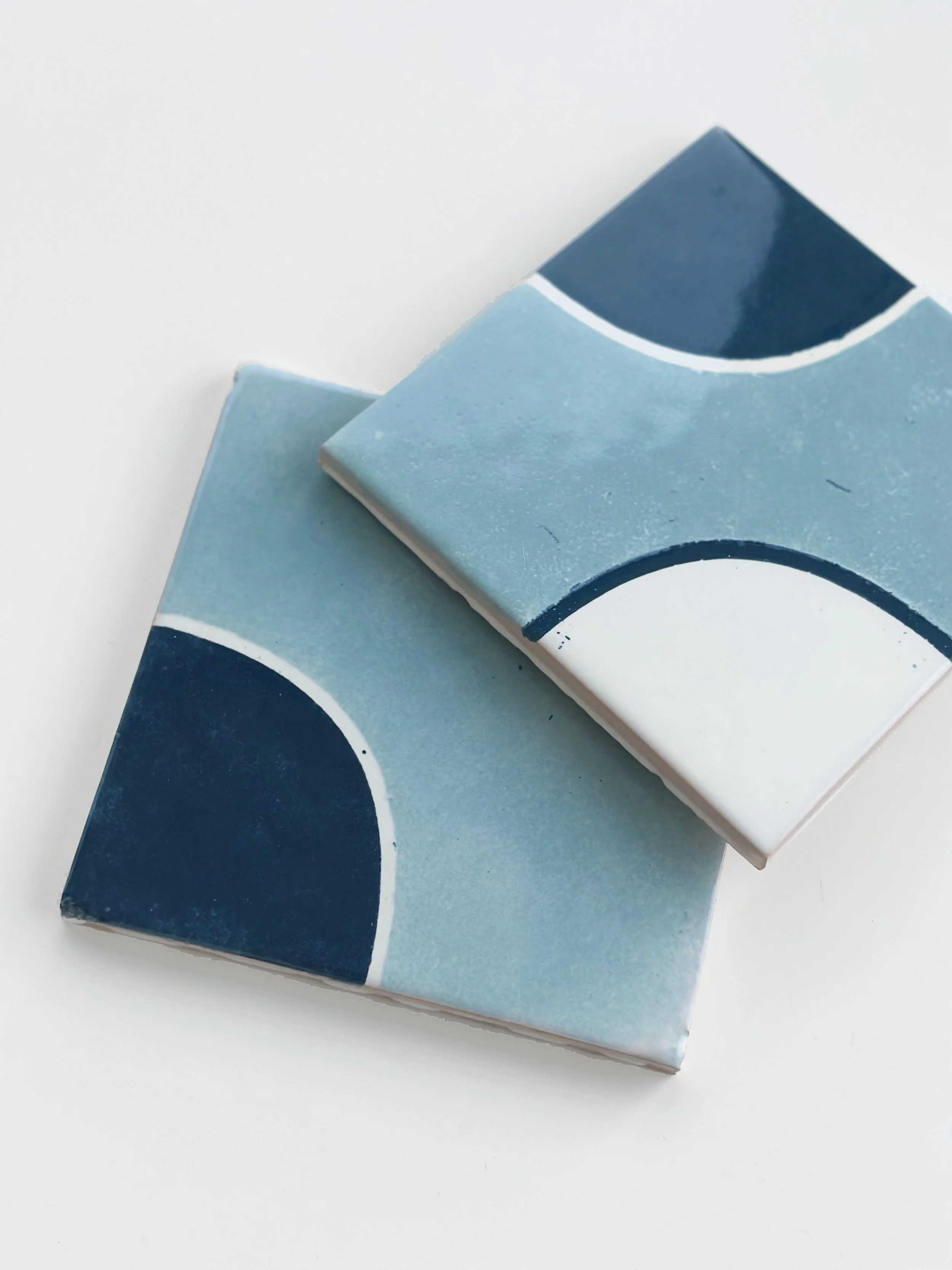image of hand-painted tiles in the colors blue and white