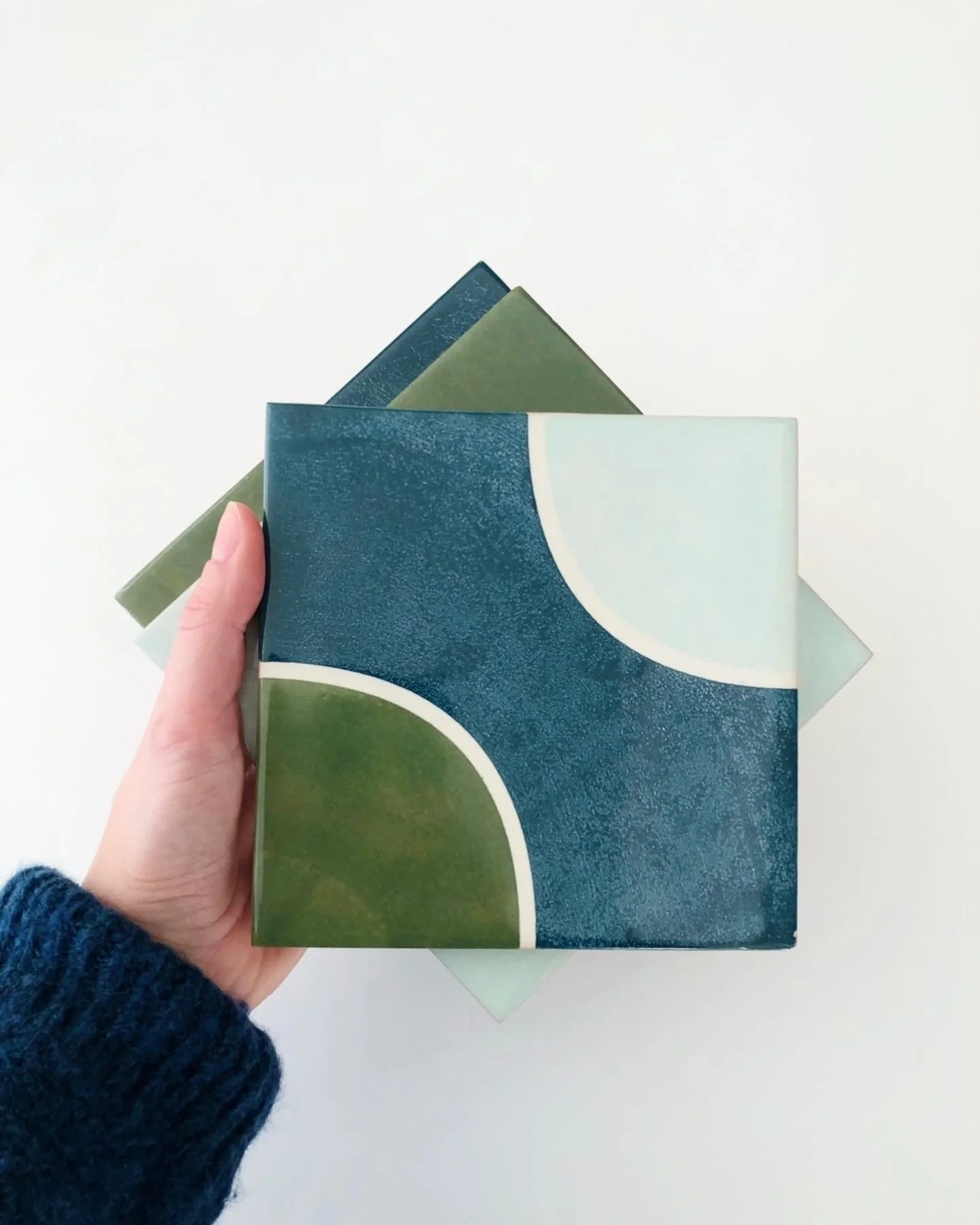 close-up of green, blue hand-painted ceramic tiles from the La Mola collection