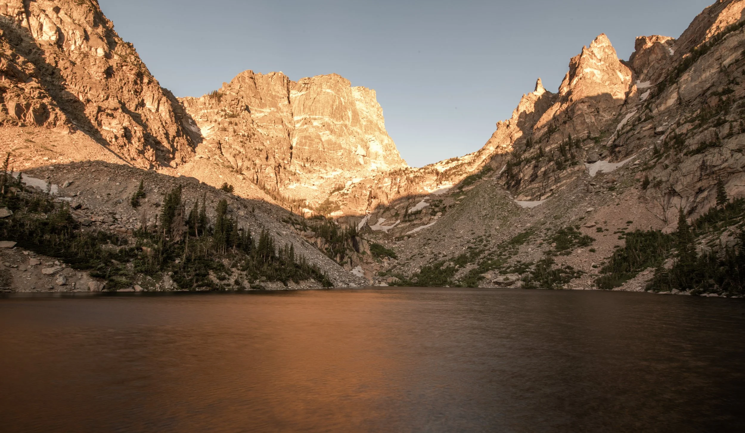 Views of a lake at sunset in Rocky Mountain National Park