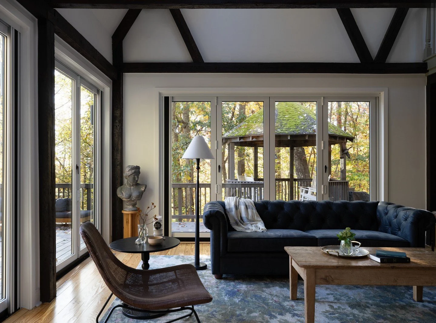 The living room was always meant to anchor the home. Open and connected, it&rsquo;s where everything comes together. The original beams and fireplace set the tone from the start, and our role was to let those elements lead while refining how the spac