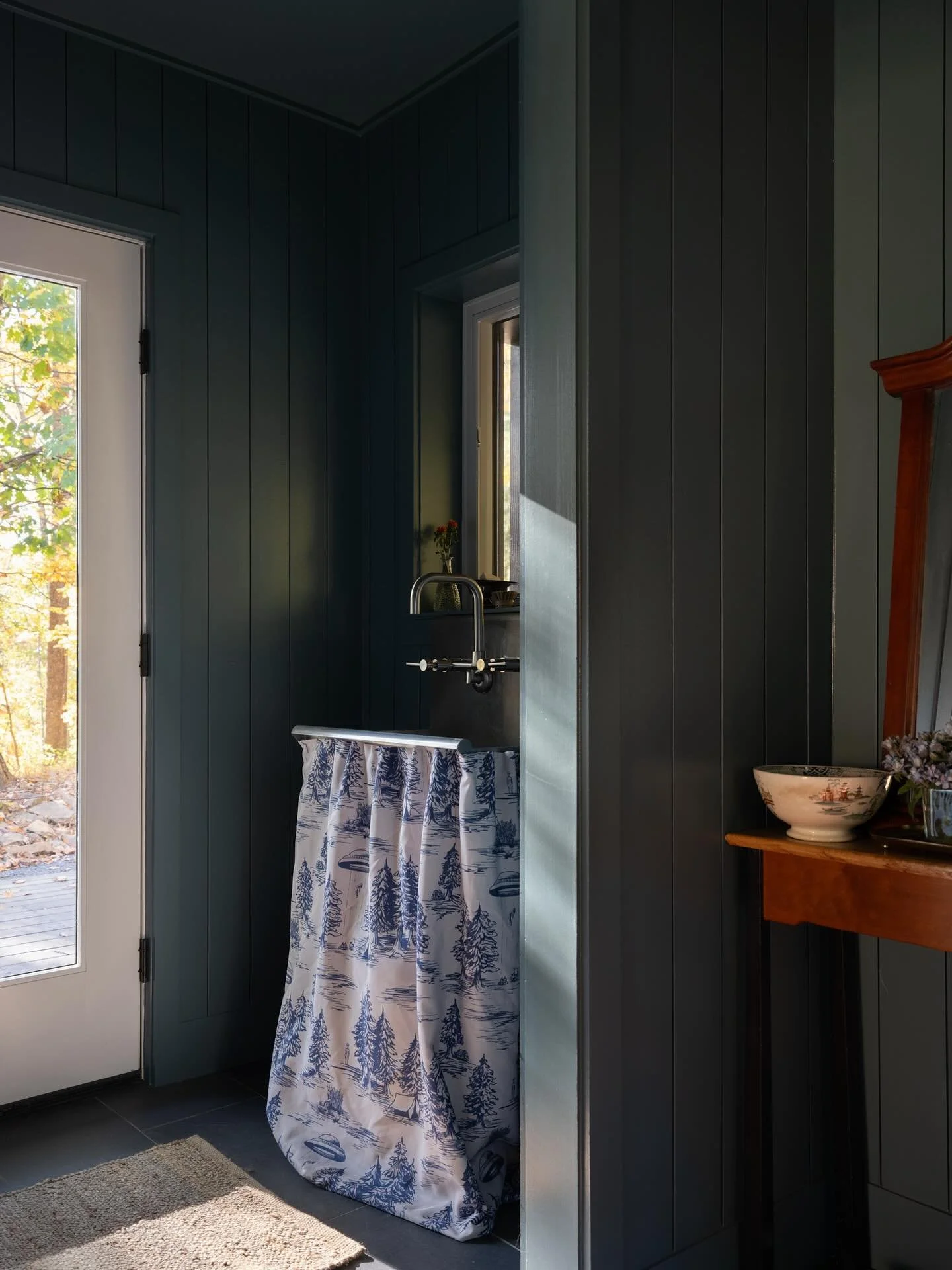 We gave our clients several funky-fun sink skirt options and they immediately loved this one. The pattern is called Alien Abduction from Spoonflower and we are equally obsessed with it!

It is playful in the best way. Tucked inside a hardworking mu