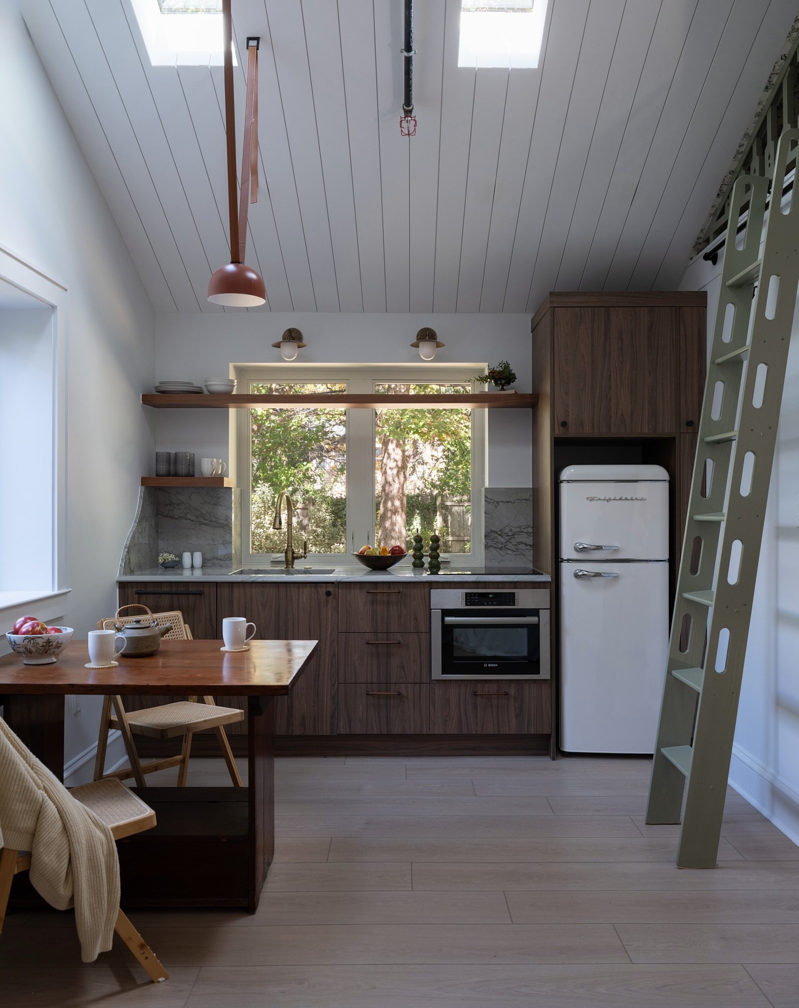 This side of the ADU just works.

You&rsquo;ve got the kitchenette, the dinette, the ladder up to the loft&hellip; all in one view, but nothing feels crowded or overworked.
We kept everything pretty consistent so it could handle a lot without feeling