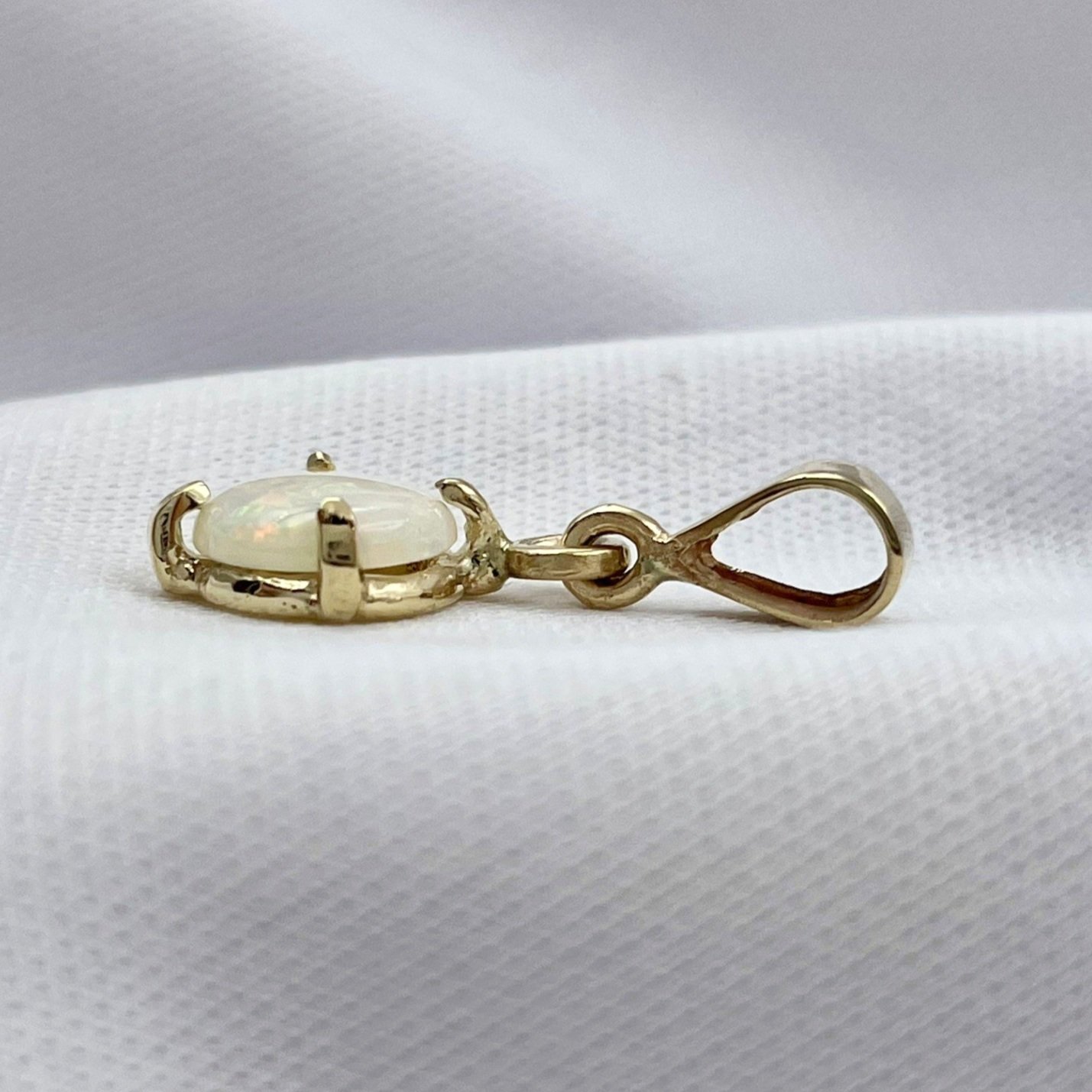 side view white background 14k Yellow Gold Pear Cut Opal With Diamond Accent Drop Pendant