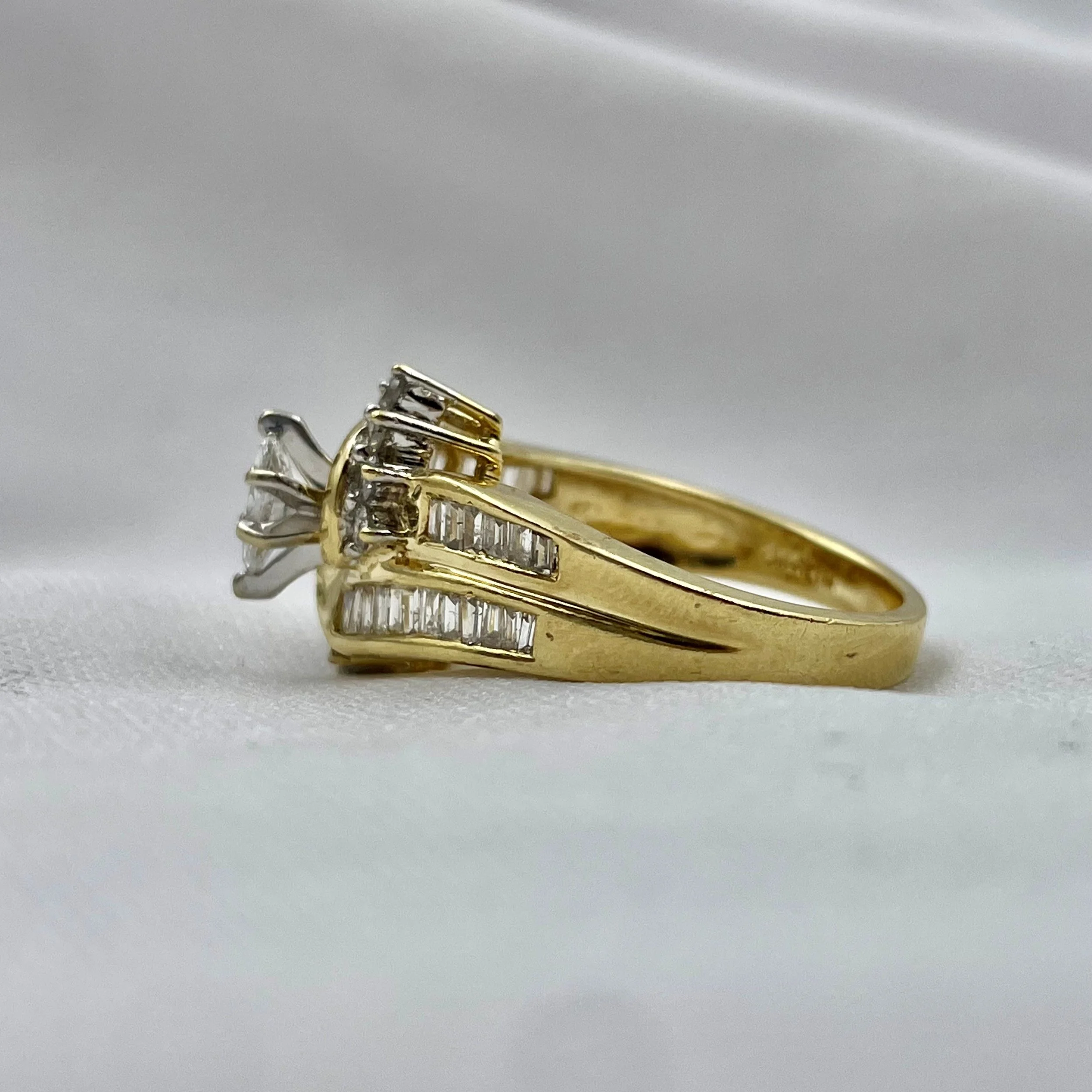 side view of 1.00ctw Marquise Diamond Statement Ring Engagement Anniversary 14k Yellow Gold white cloth background