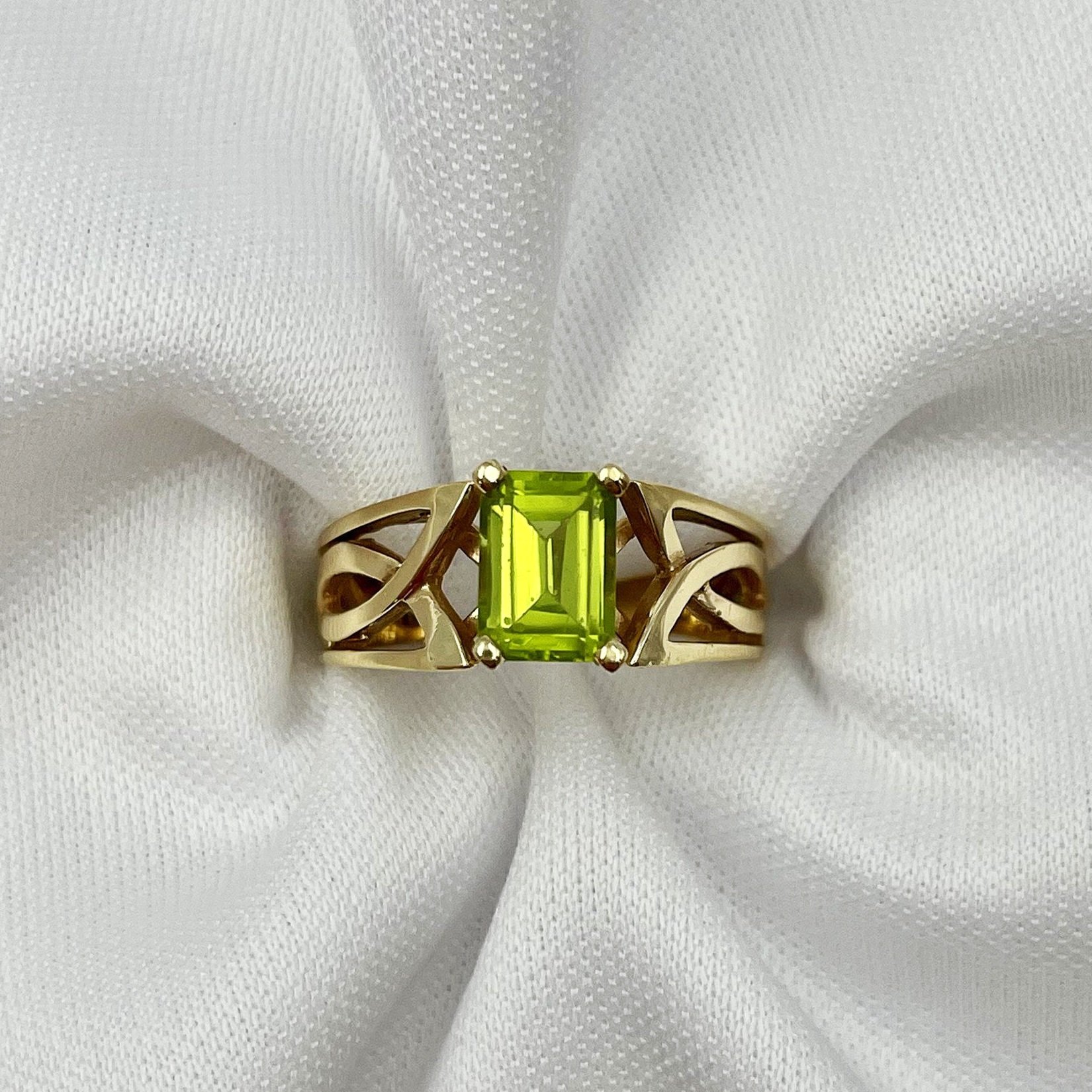 top down view white background Peridot Emerald Cut Celtic Knot Inspired 14k Yellow Gold Ring