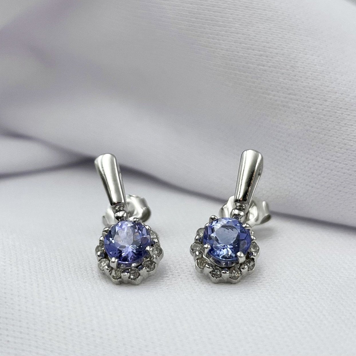 close up white background Tanzanite With Diamond Halo Drop Stud Earrings 14k White Gold