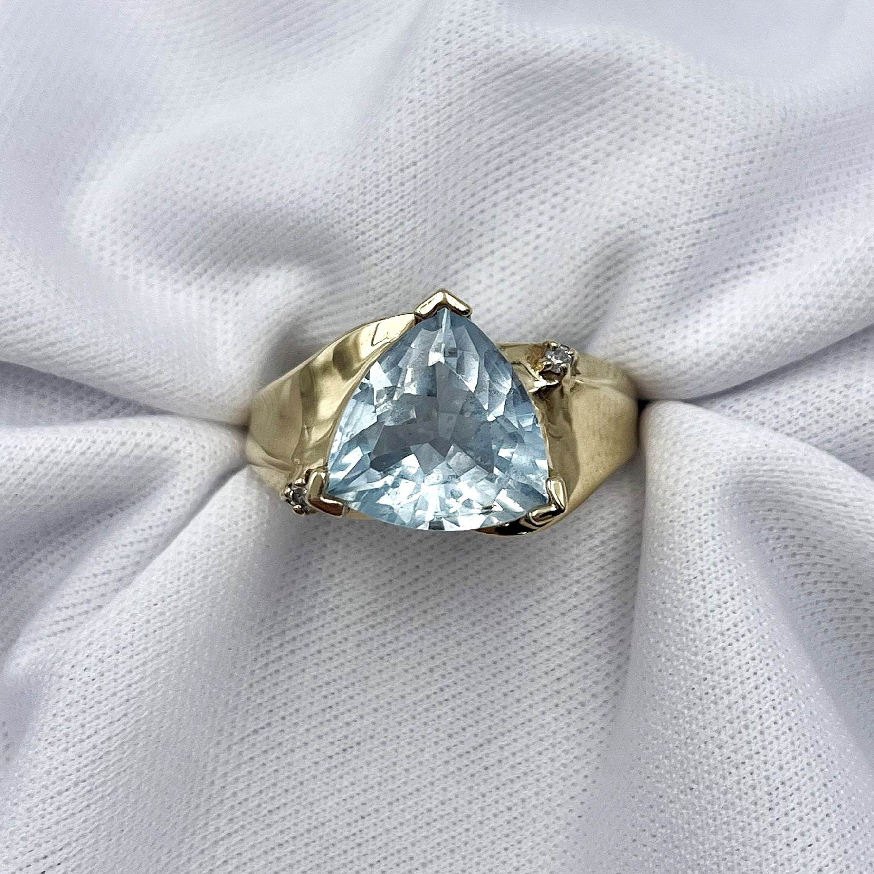 top down front view white background Trillion Cut Blue Topaz With Diamond Accents Ladies 10k Yellow Gold Ring
