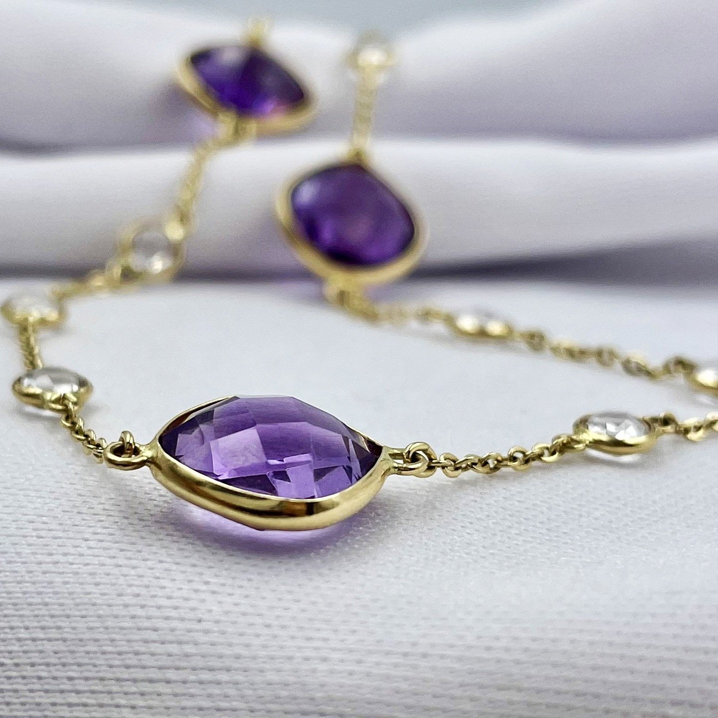 close up white background 18" Amethyst By The Inch Pendant Chain 14k Yellow Gold