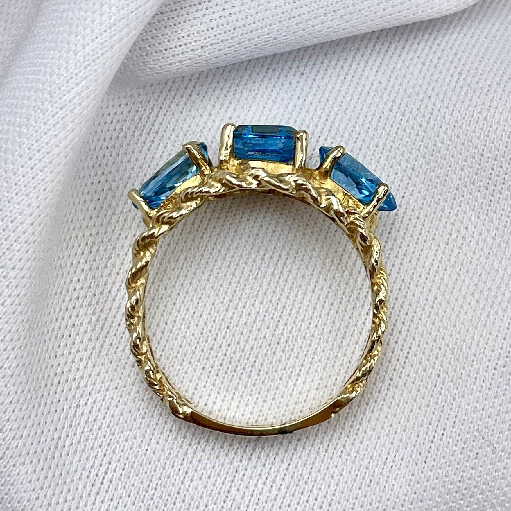 top down gallery view 14k Yellow Gold Blue Topaz Three Stone Ladies Ring