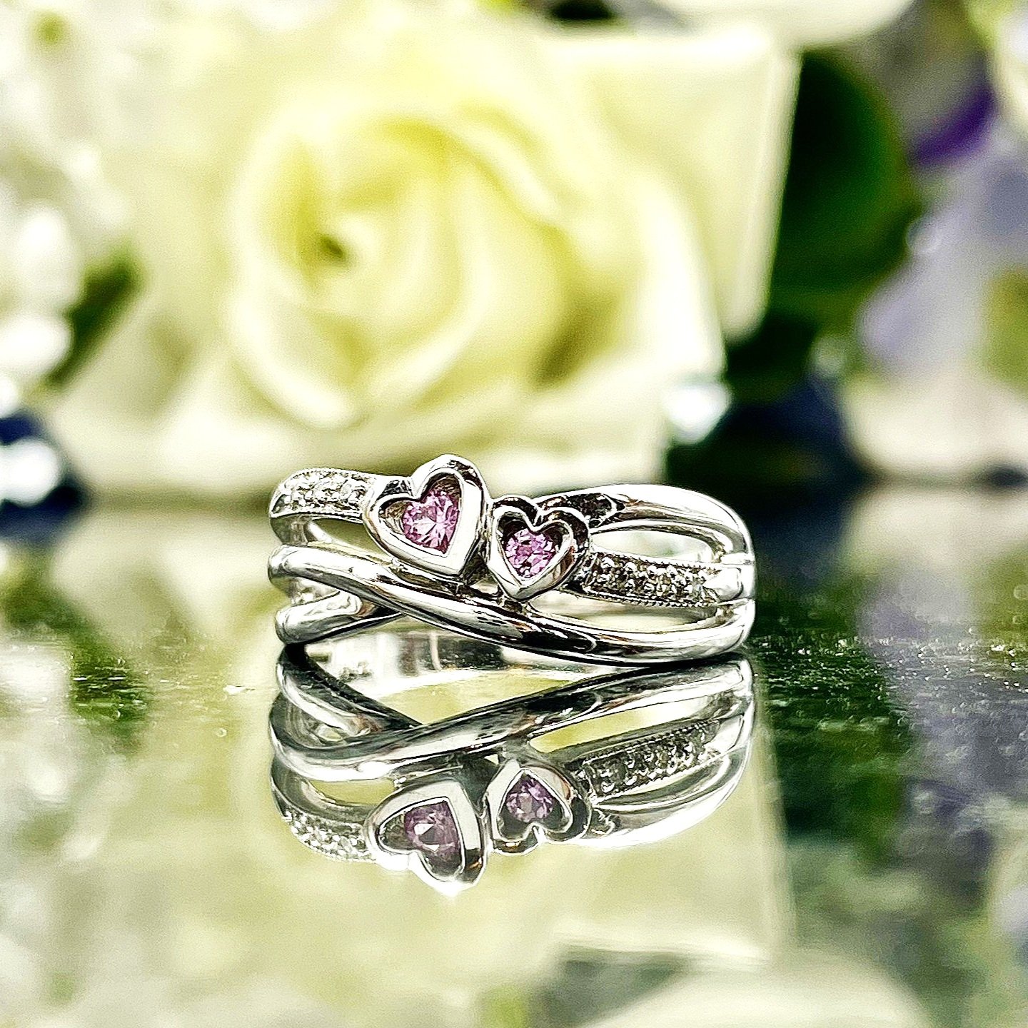 close up in front of flowers Double Heart Pink Tourmaline With Diamond Accents 10k White Gold Promise Ring