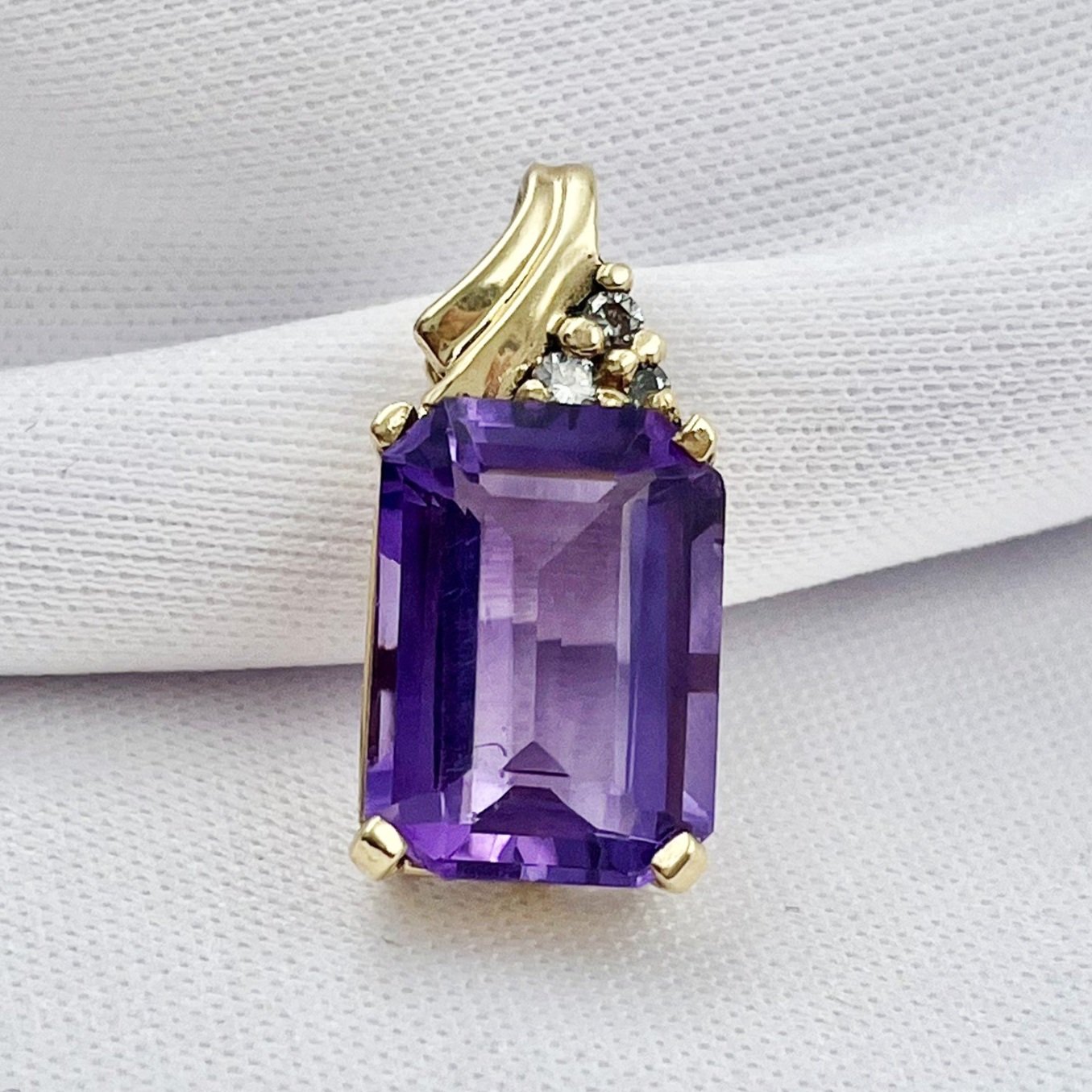 close up white background 14k Yellow Gold Pendant 14x10mm Emerald Cut Amethyst With Diamond Accents