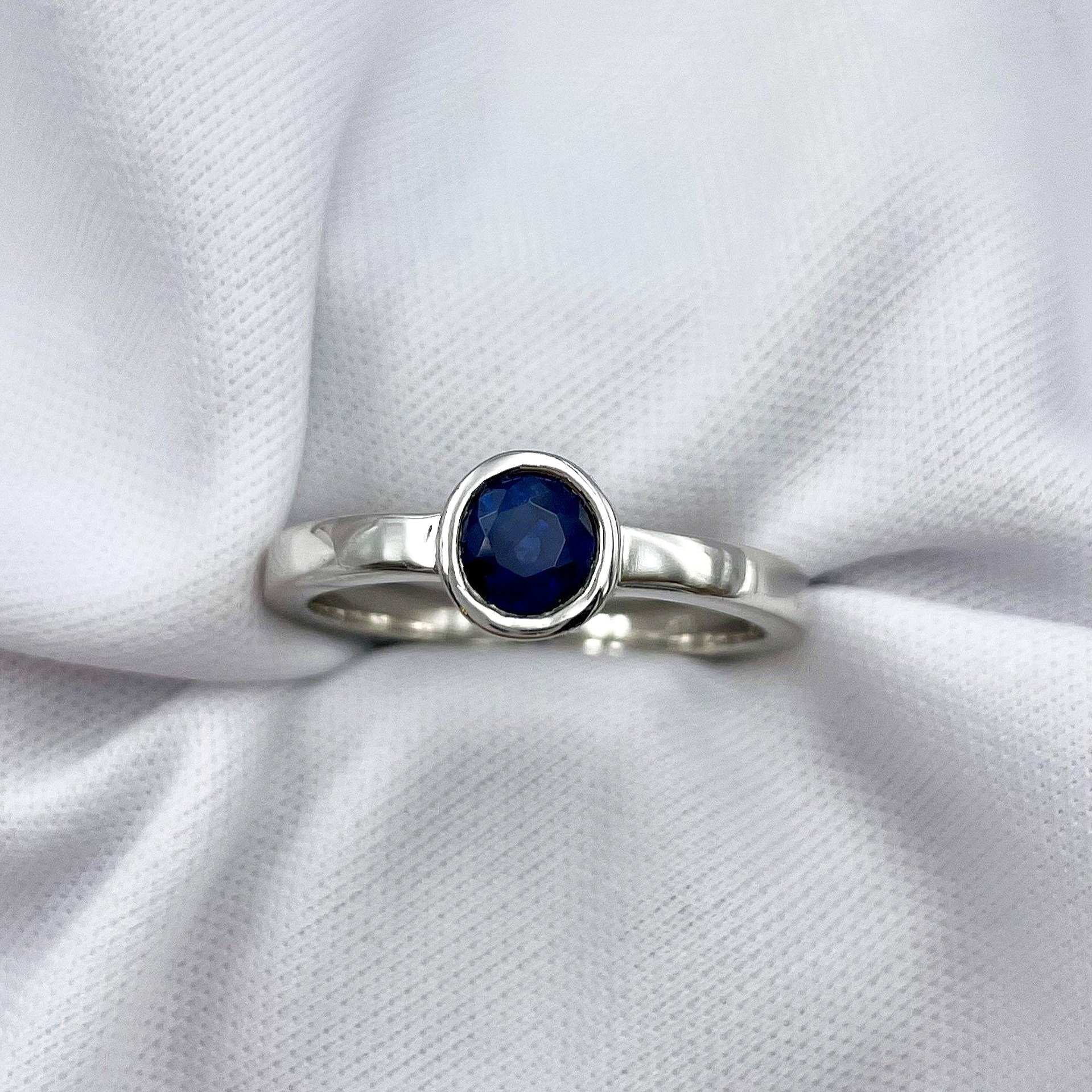 top down white background 14k White Gold Bezel Set Sapphire With Peekaboo Diamonds Ladies Ring