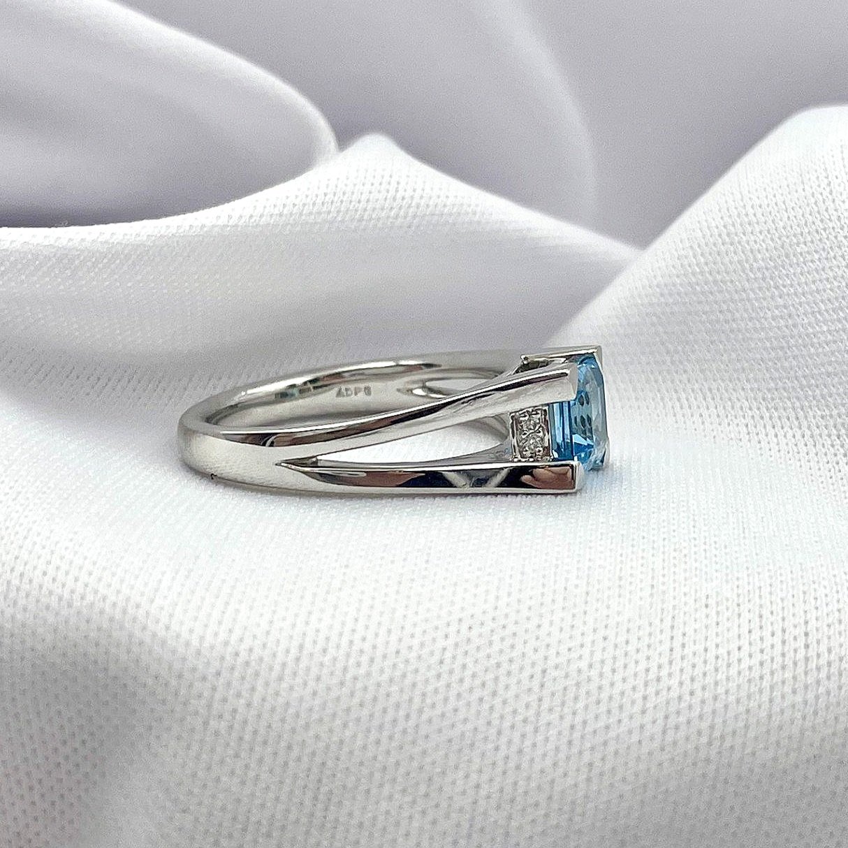 side view white background 14k White Gold Blue Topaz And Diamond Split Shoulder Ring