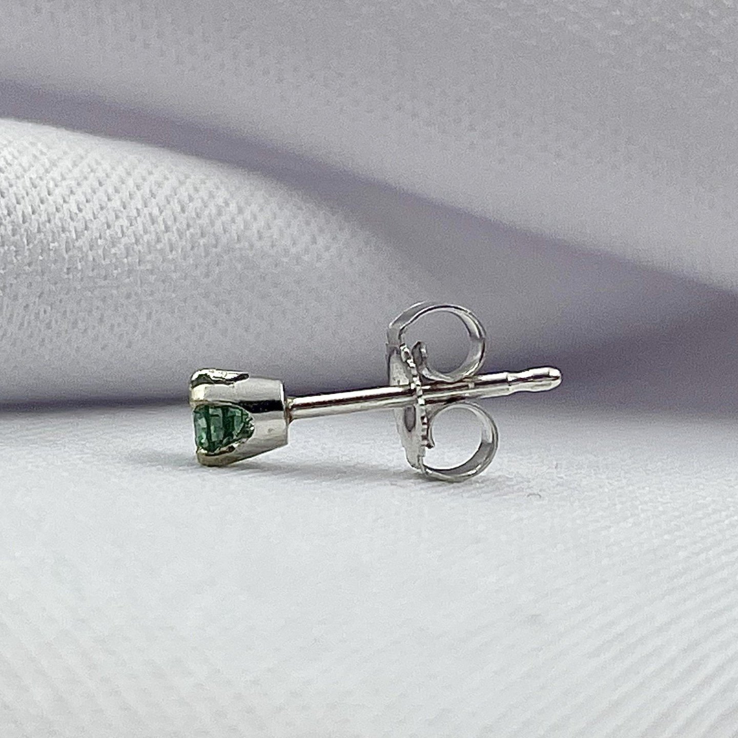 side view white background .24ctw Blue Diamond Solitaire Stud Earrings 14k White Gold