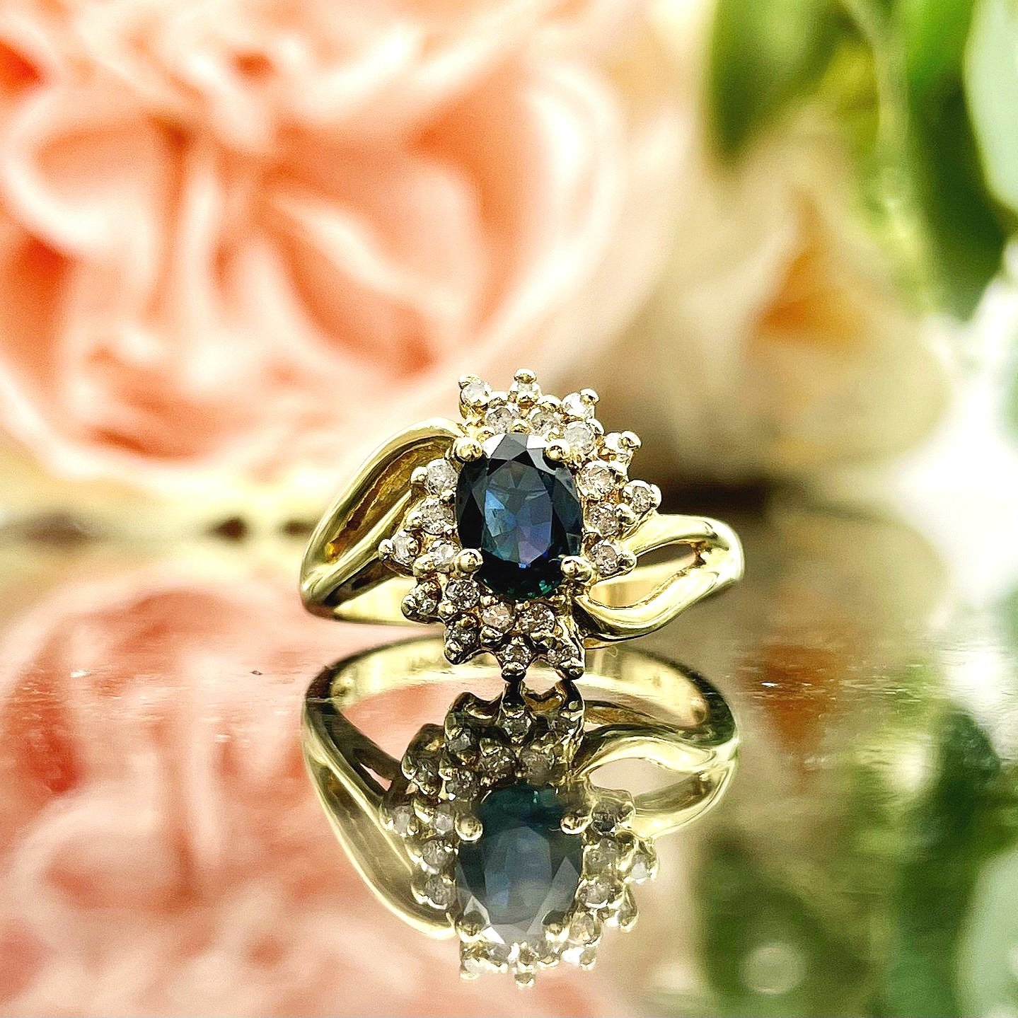 close up in front of flowers Floral 10k Yellow Gold Oval Sapphire With Diamond Accents Ladies Ring