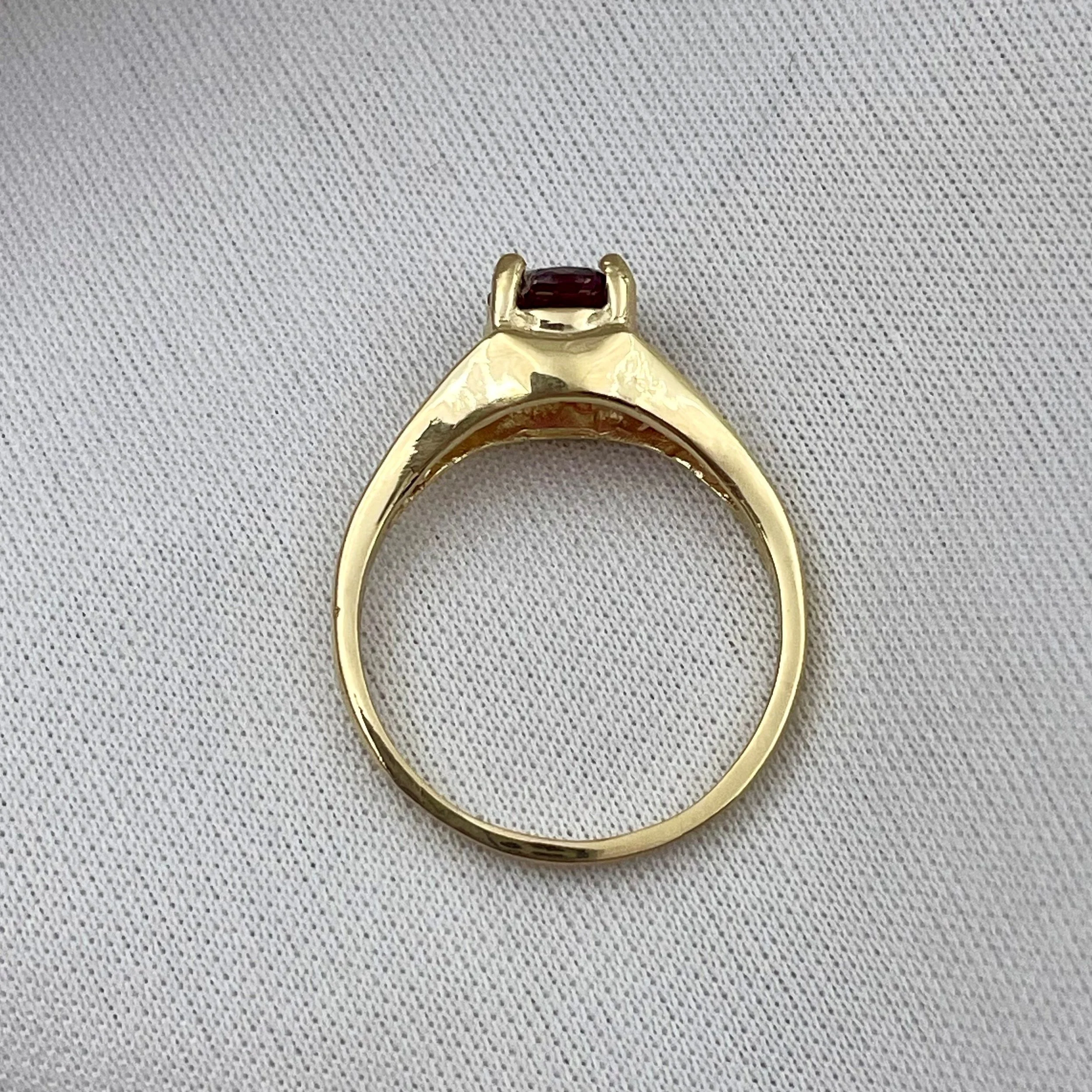 top down gallery view of 14k Yellow Gold 6mm Round Garnet Ladies Rings With Filigree Shoulders in front of white background