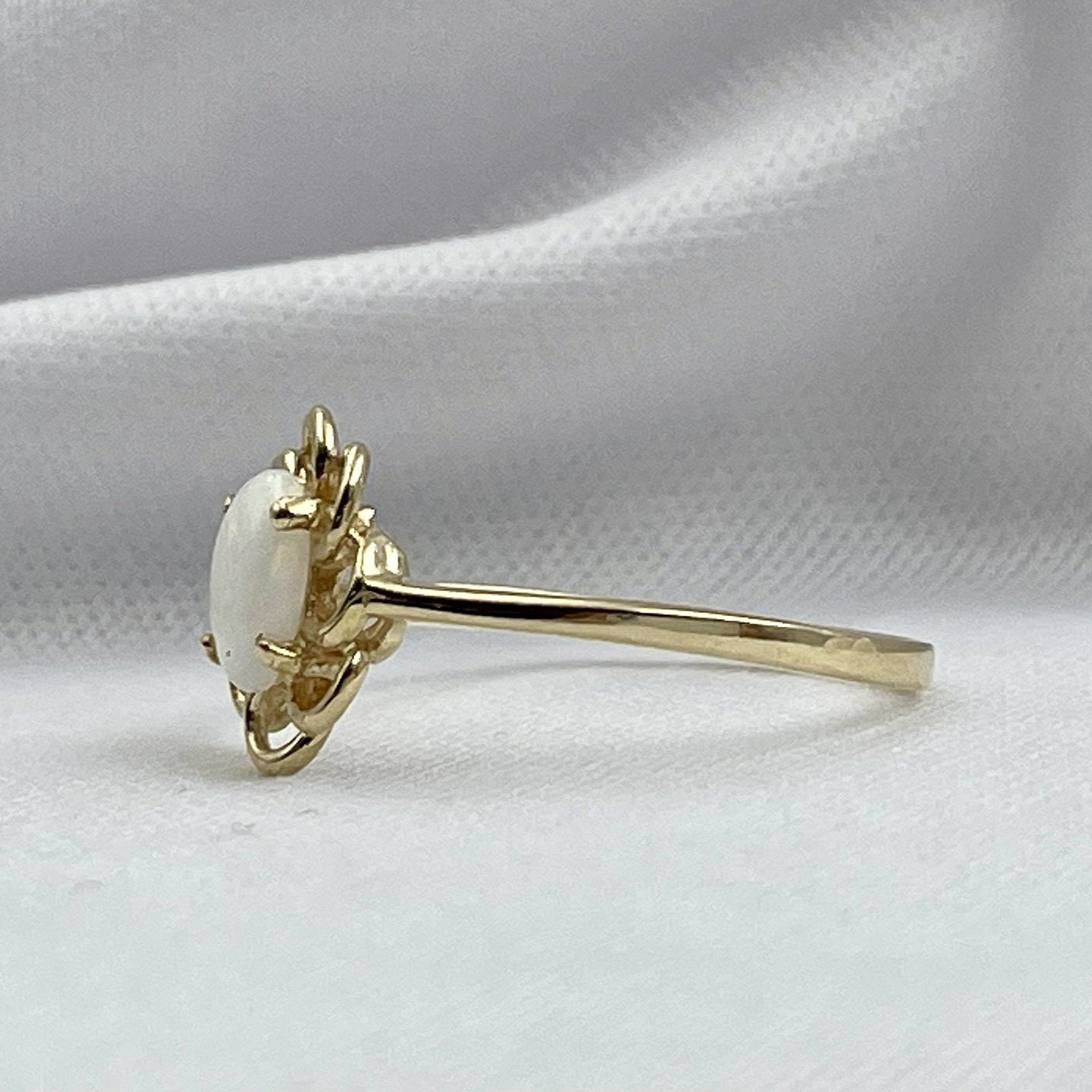 side view white background Ladies Oval Opal Ring Floral Detailing 10k Yellow Gold