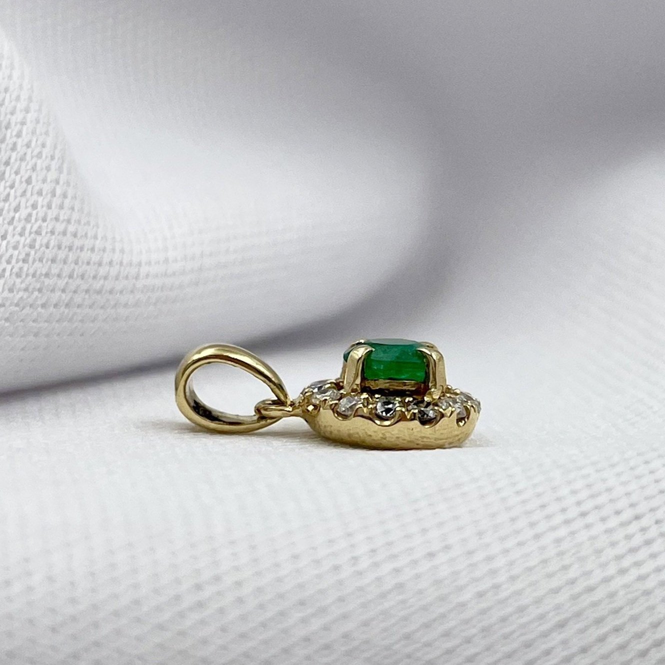 side view white background 18k Yellow Gold Emerald With Diamond Halo Pendant