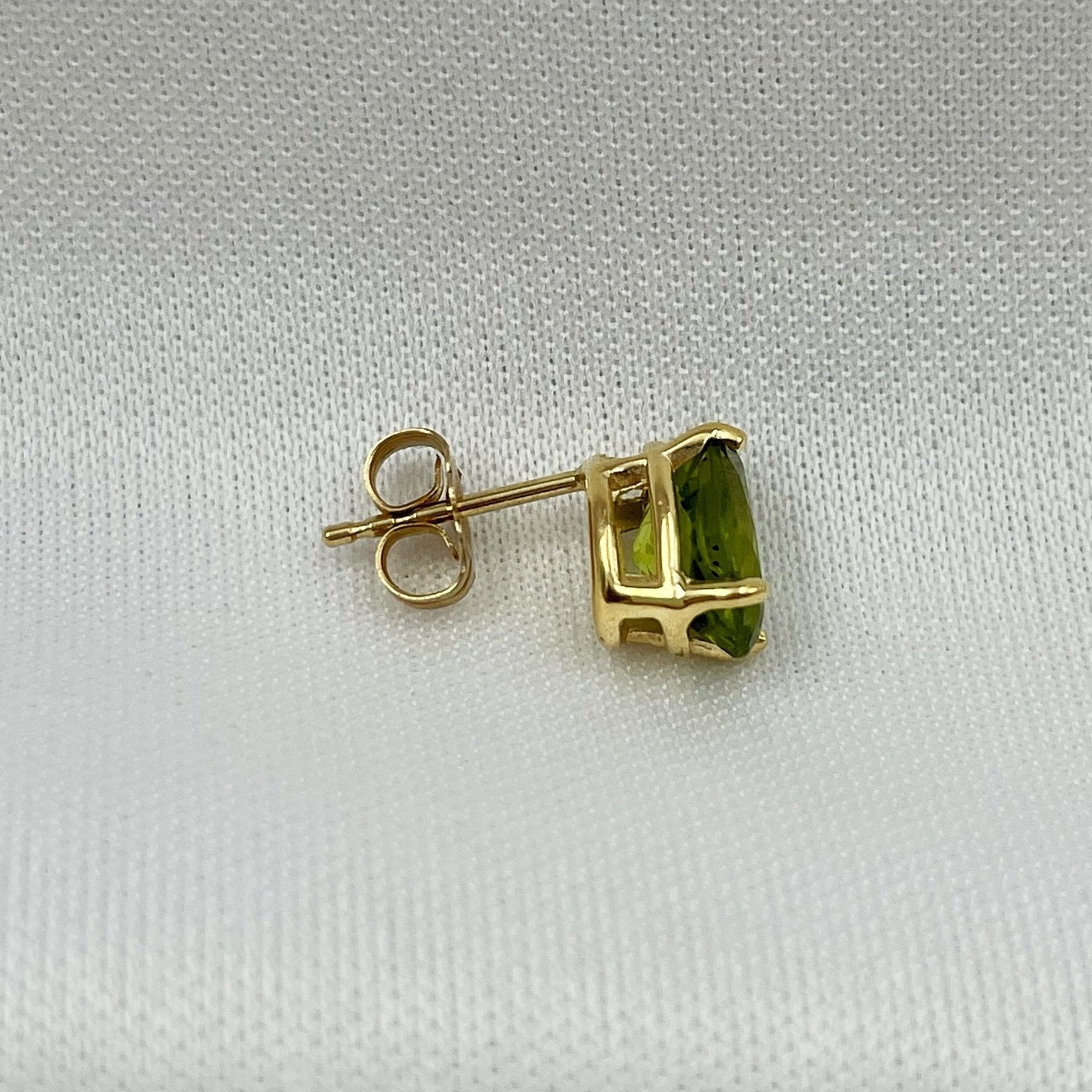 side view white background Peridot Stud Earrings 8x6mm Oval Cut 14k Yellow Gold