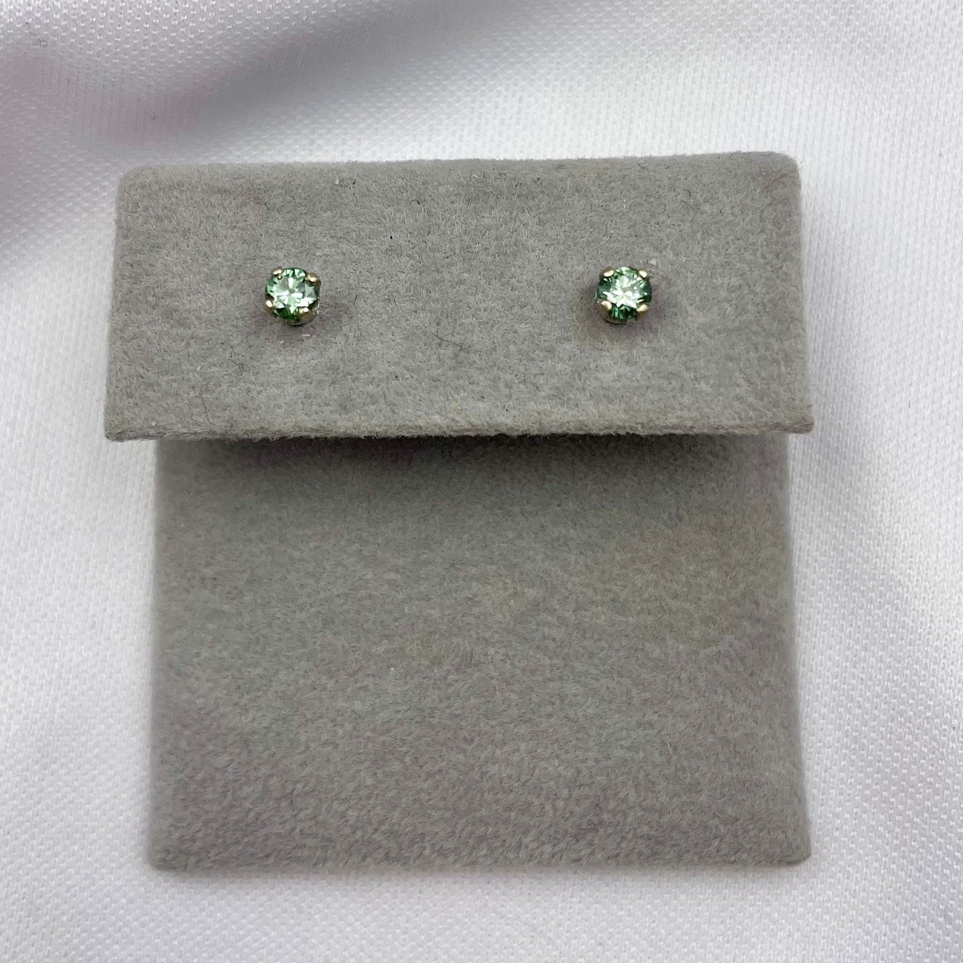 top down view white background .24ctw Blue Diamond Solitaire Stud Earrings 14k White Gold