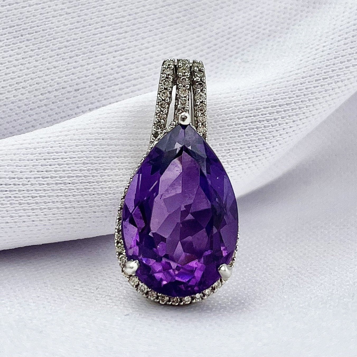 close up white background 5.65ct Pear Cut Amethyst With .22ctw Diamond Accents And Halo Pendant 14k White Gold