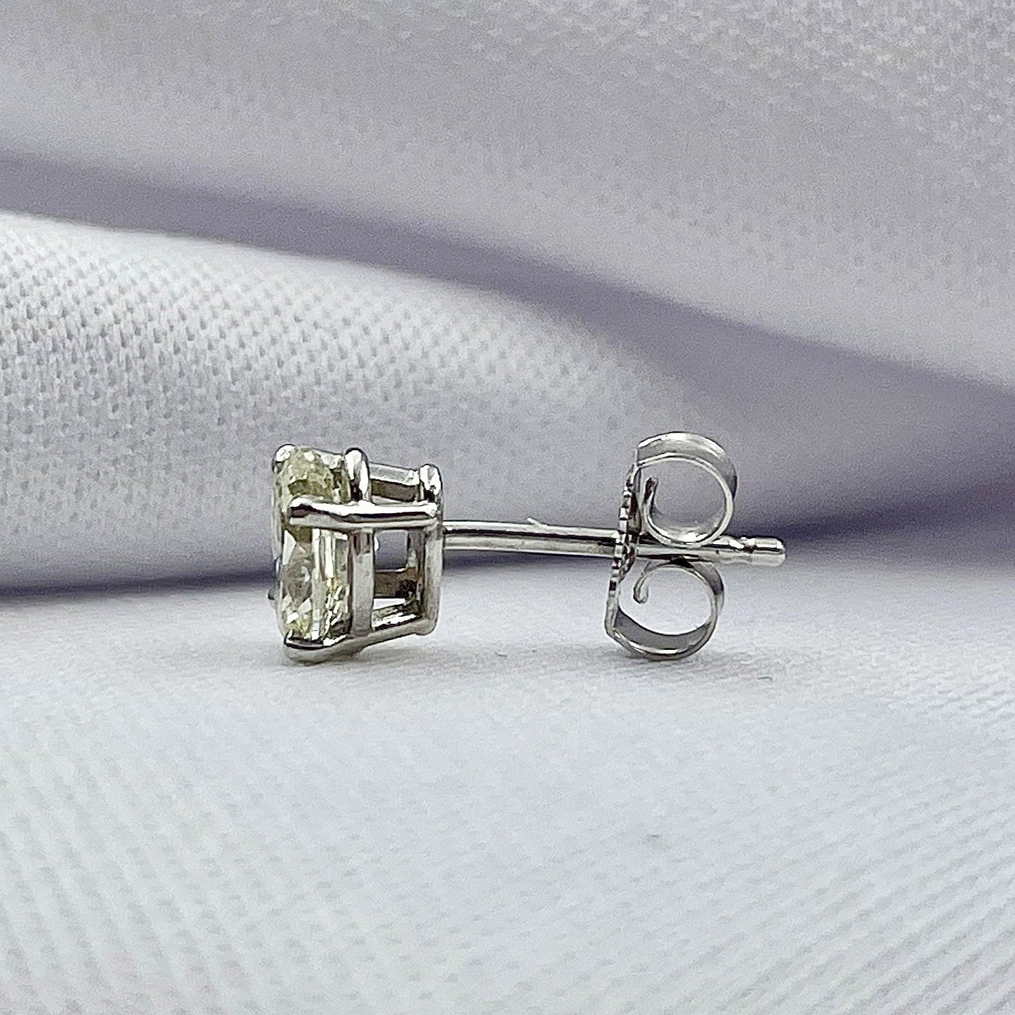 side view white background .92ctw Oval Cut Diamond Solitaire Stud Earrings 14k White Gold