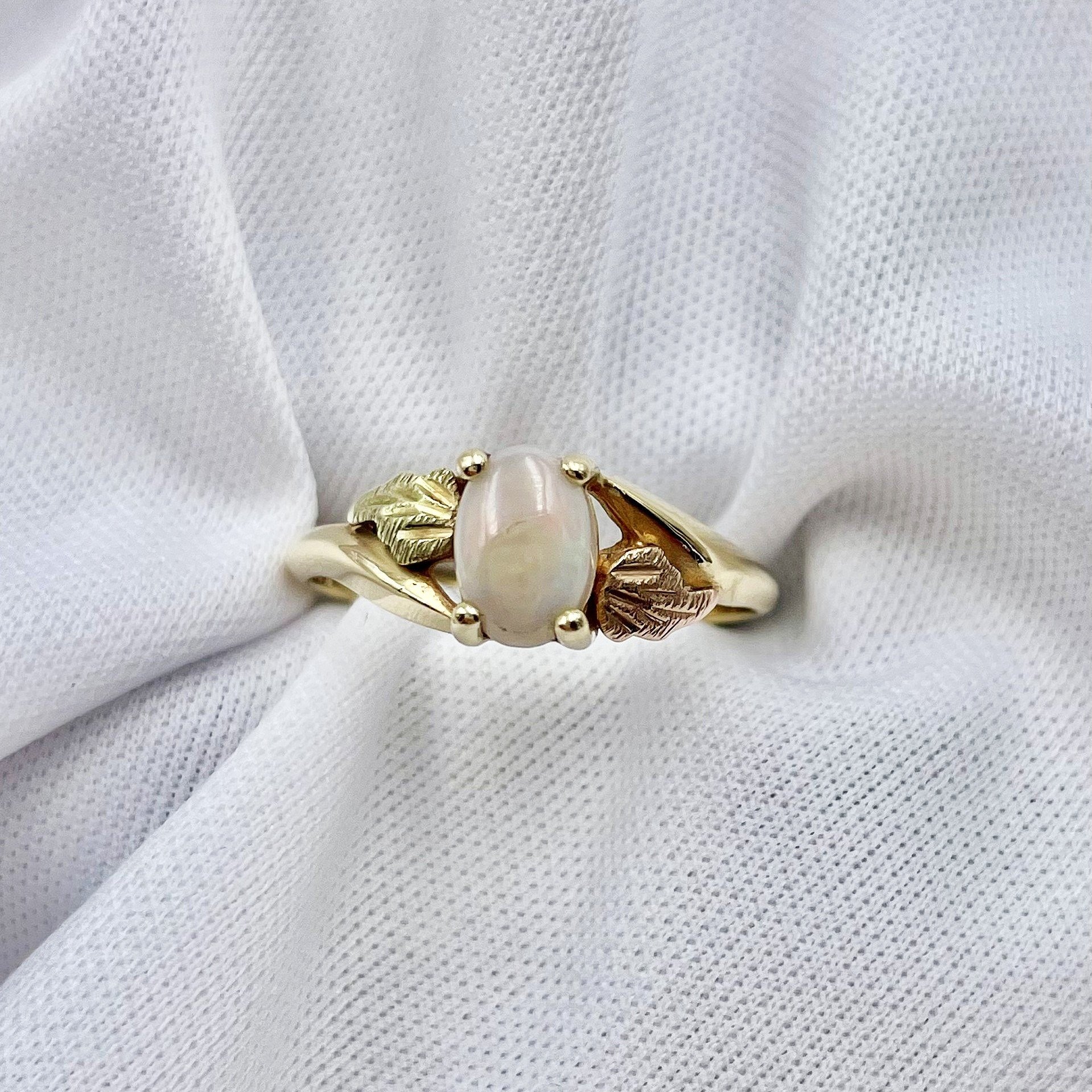 top down white background 10k Ladies Black Hills Gold Vintage Inspired Oval Opal Ring