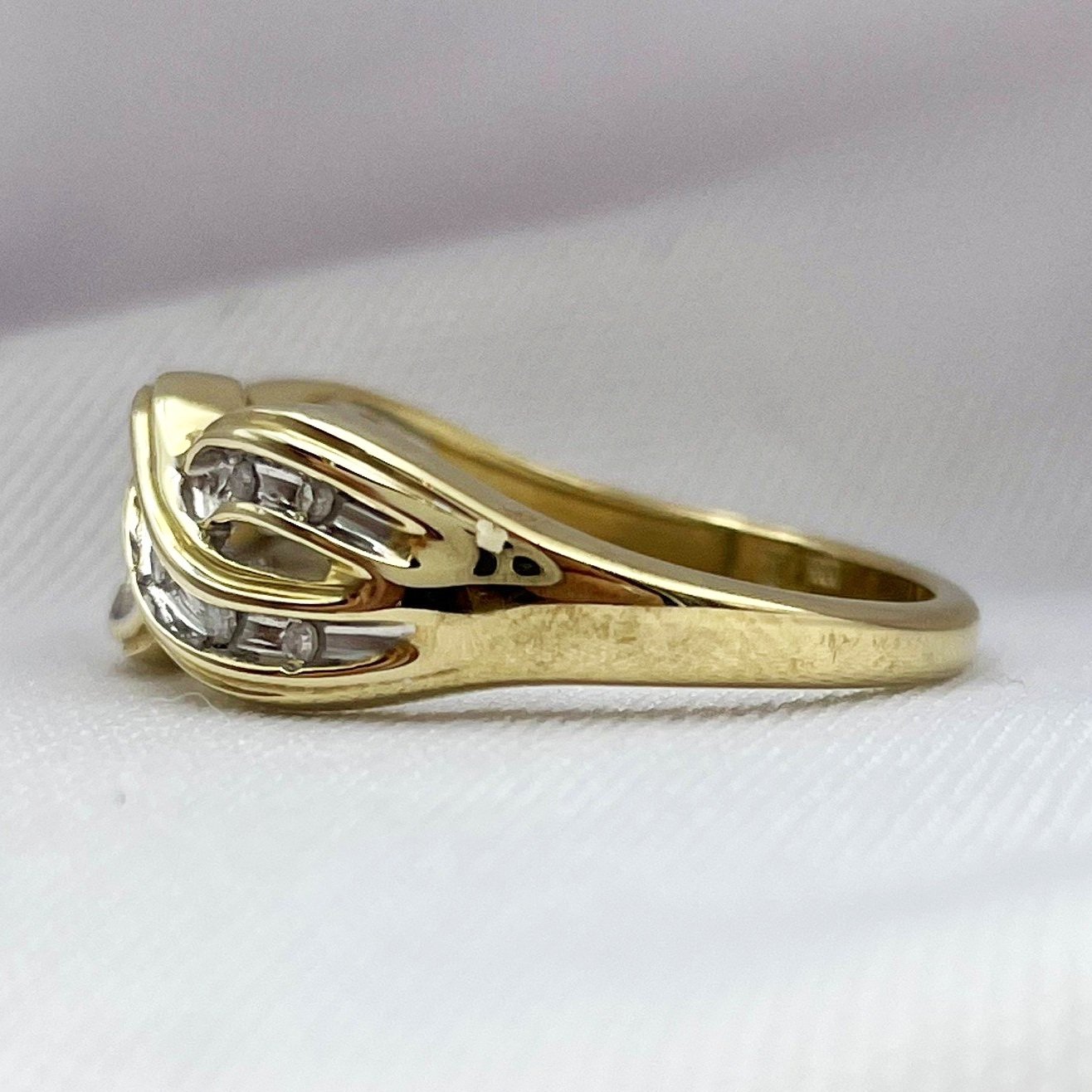 side view white background 10k Yellow Gold Braided Channel Band 1/10ctw Diamond Ring