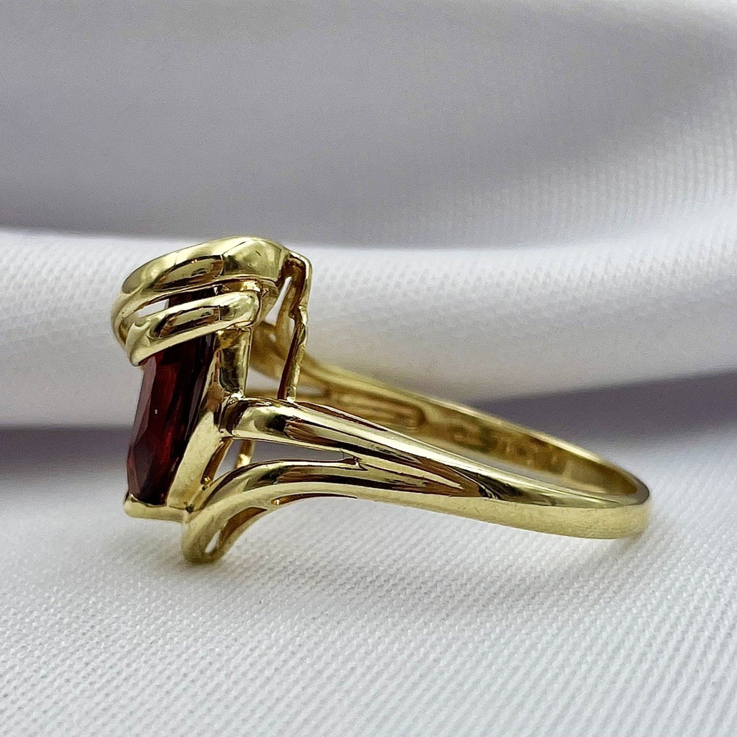 side view white background 10k Yellow Gold Marquise Garnet With Diamond Accents Ladies Ring
