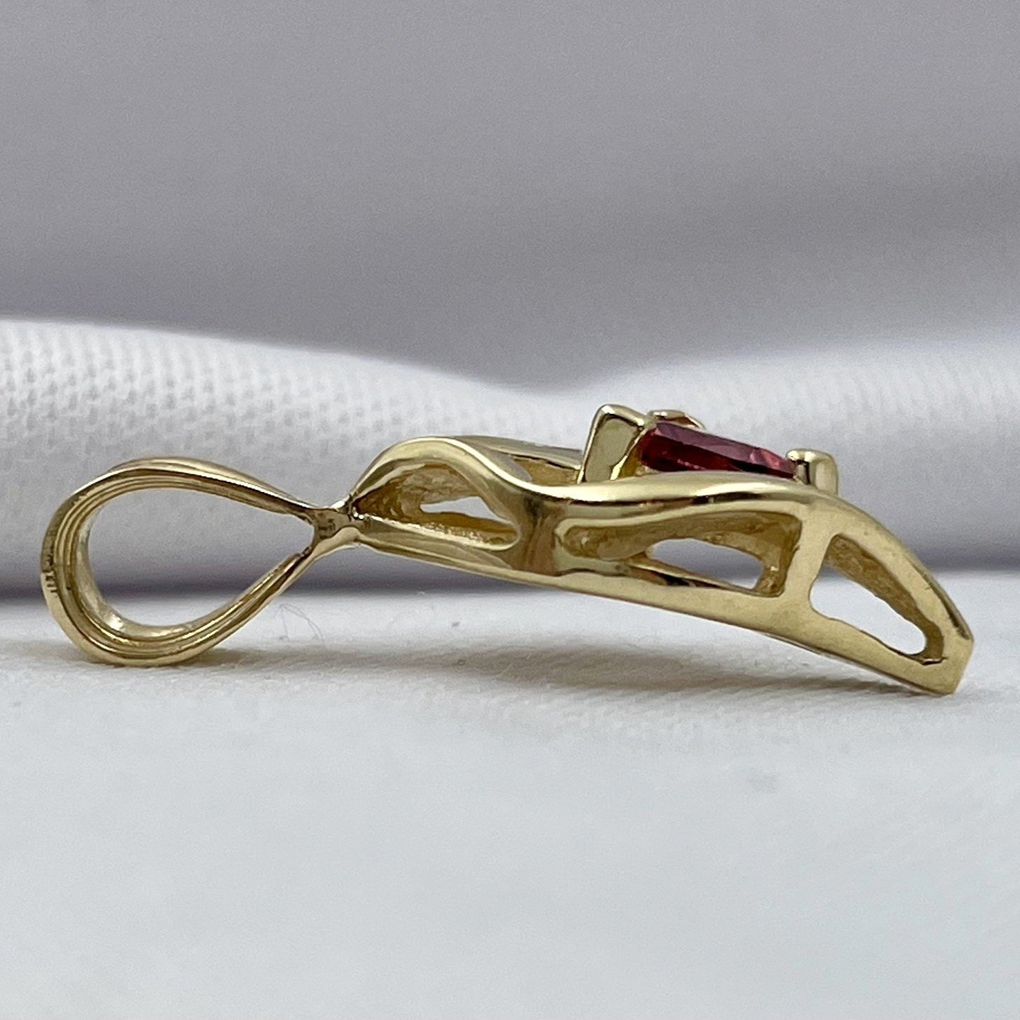 side view white background 10k Yellow Gold Trillion Rhodolite Garnet With Diamond Accent Drop Pendant