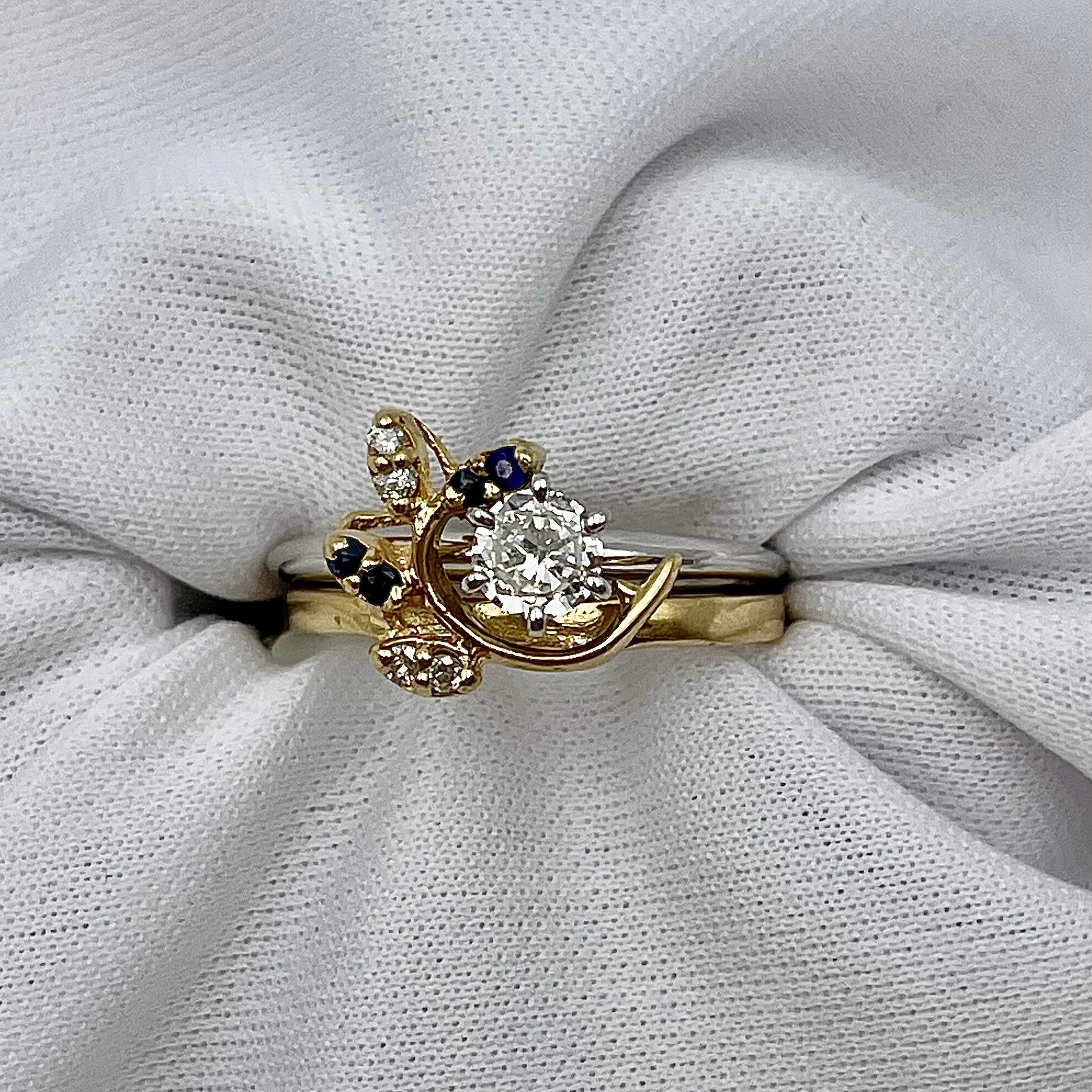 top down view with solitaire Engagement ring not included of 14k Yellow Gold Sapphire And Diamond Leaf Wrap Wedding Band white background