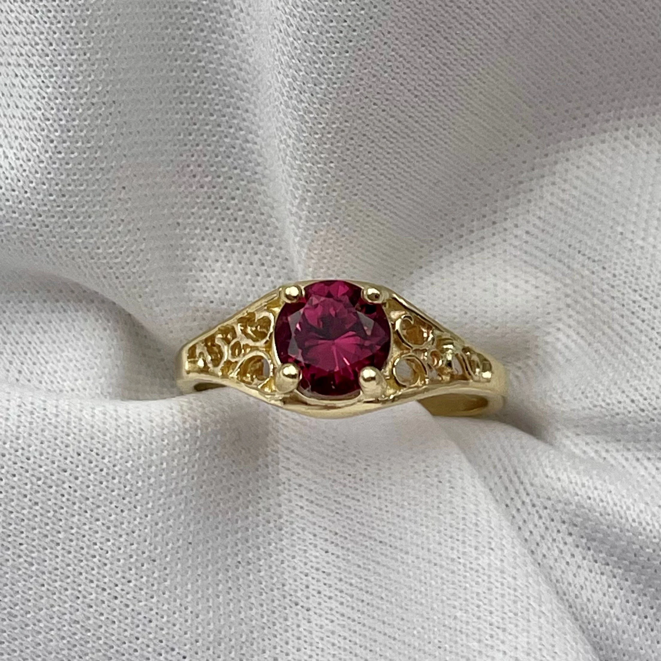 top down front view 14k Yellow Gold 6mm Round Garnet Ladies Rings With Filigree Shoulders in front of white background