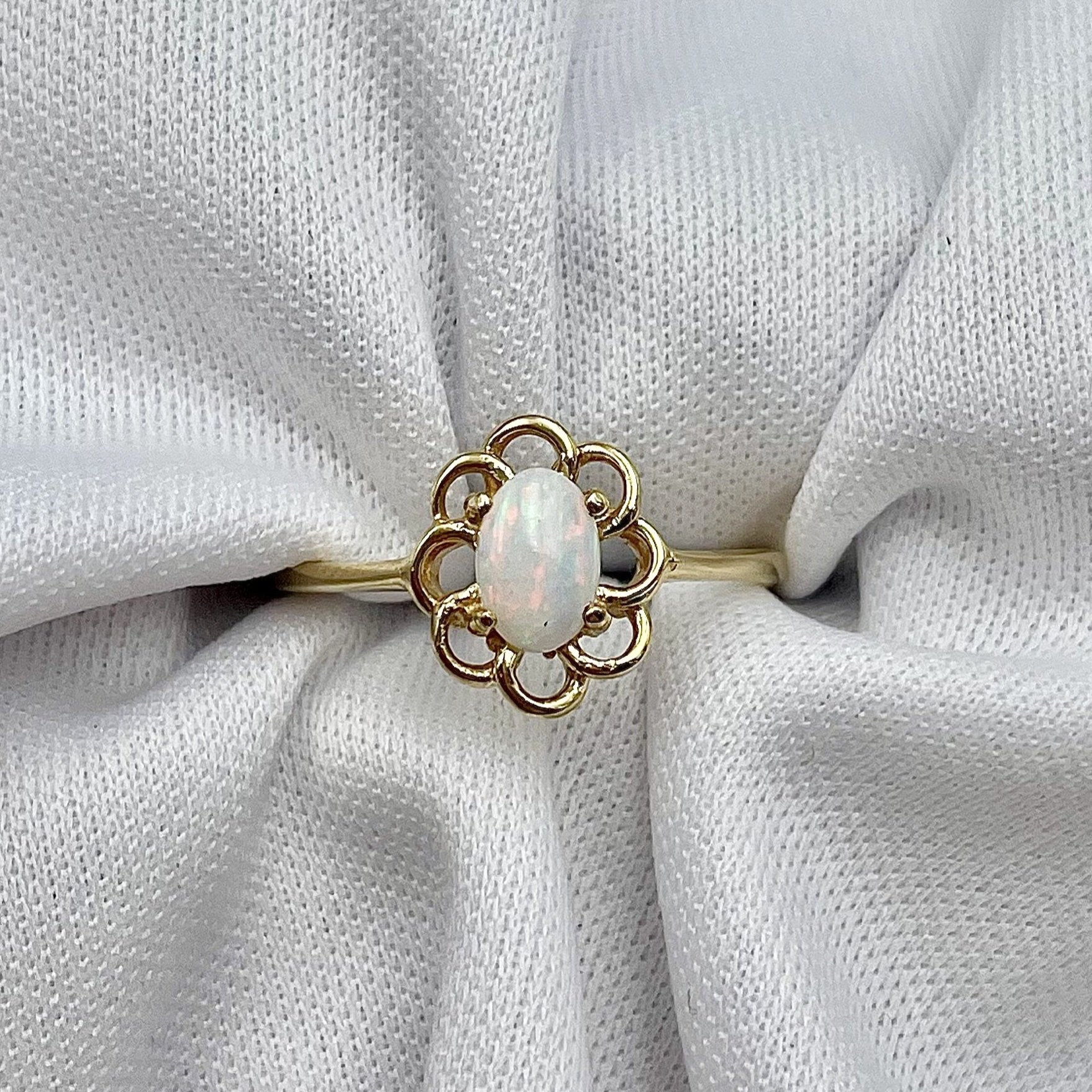 top down view white background Ladies Oval Opal Ring Floral Detailing 10k Yellow Gold
