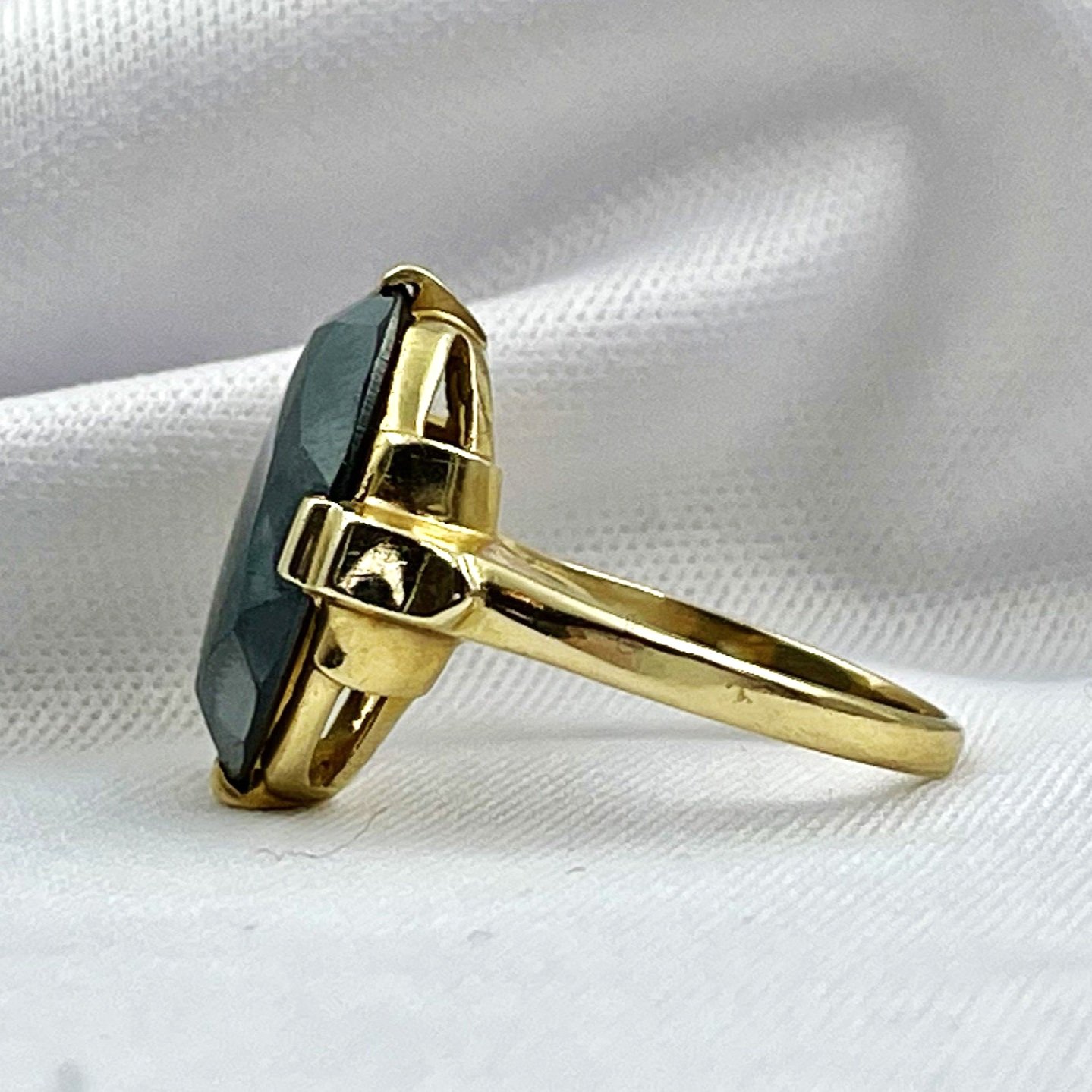 side view white background 14k Yellow Gold Estate Oval Hematite Ring
