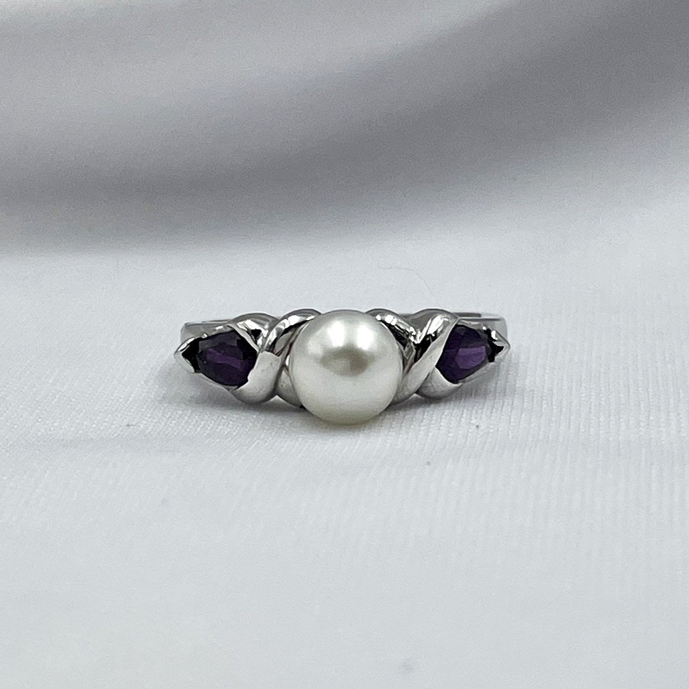 close up white background 14k white Gold Pearl And Ruby Ring