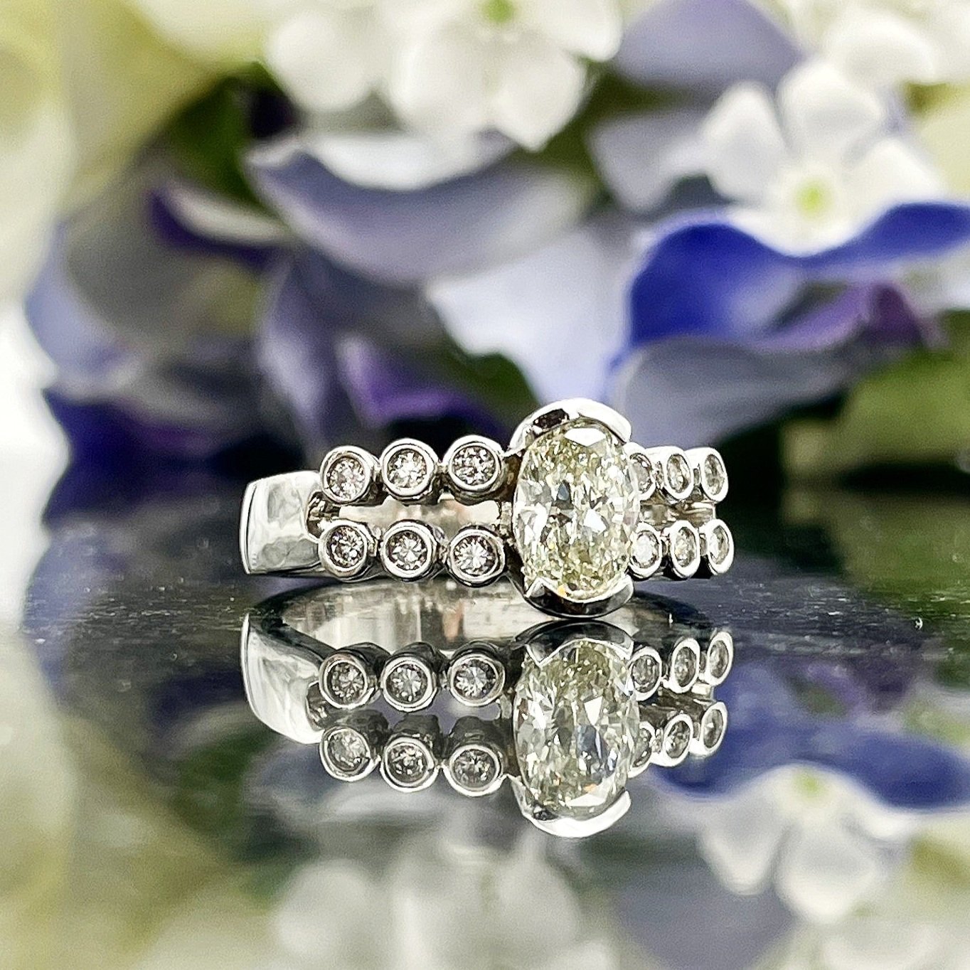 close up in front of flowers 1.27ctw Diamond Sleek Modern Oval Engagement Statement Ring 14k White Gold