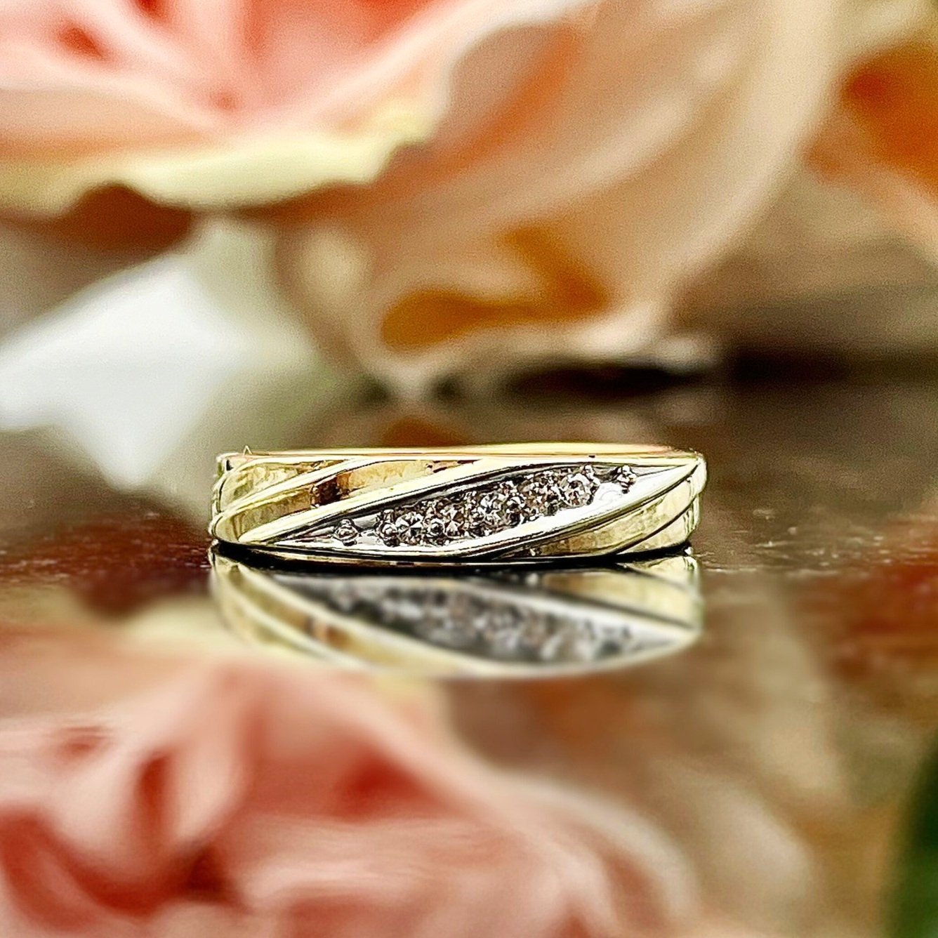 close up in front of flowers 14k Yellow Gold Ladies Diamond Band Wedding Anniversary