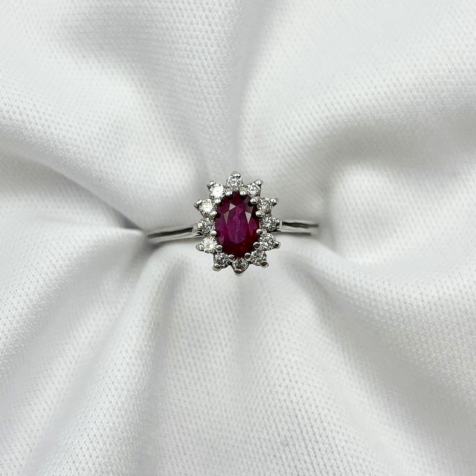 top down view white background 1/2ct Ruby Oval With Diamond Halo 14k White Gold Ladies Ring
