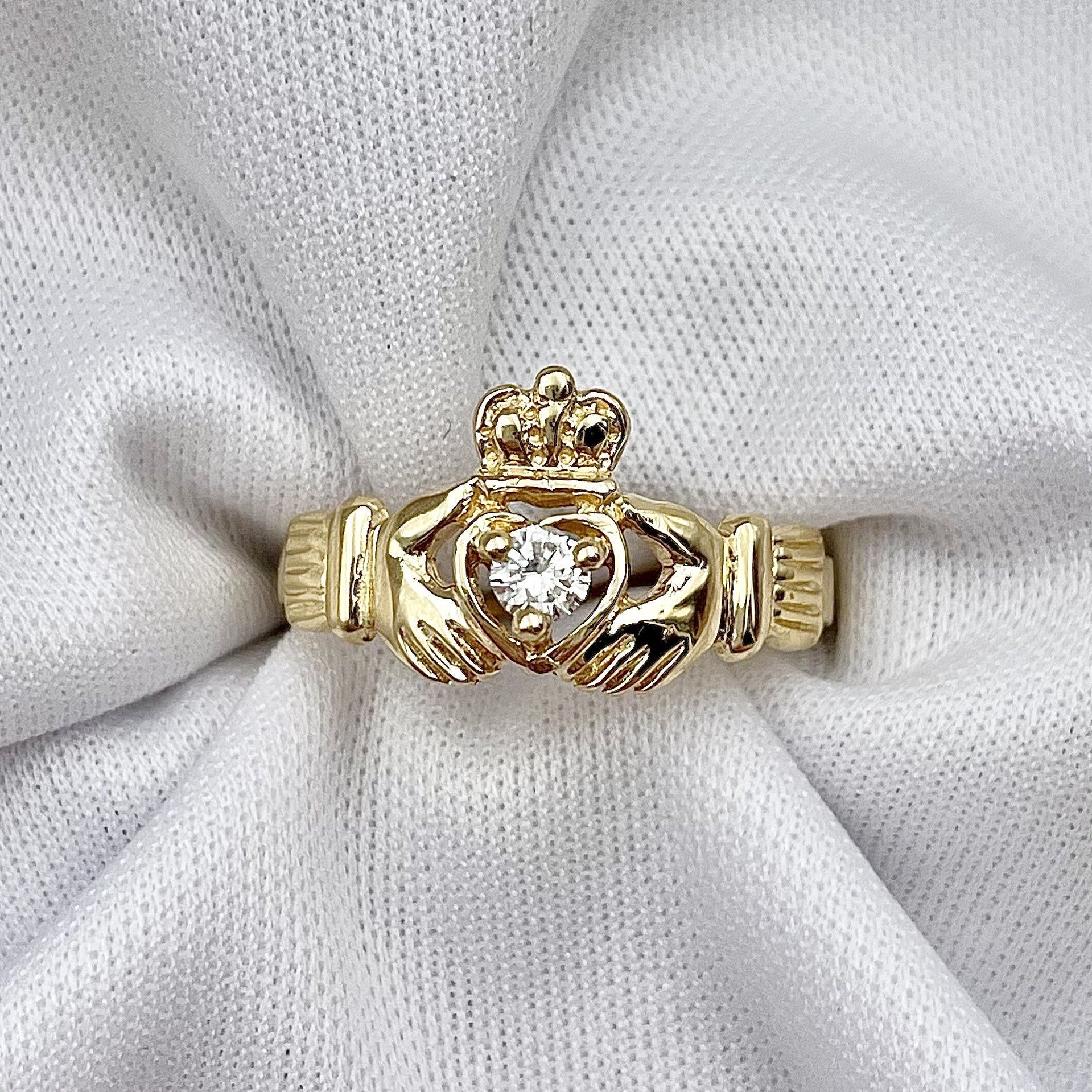 top down white background 14k Yellow Or White Gold .11ct A Quality Diamond Claddagh Ring