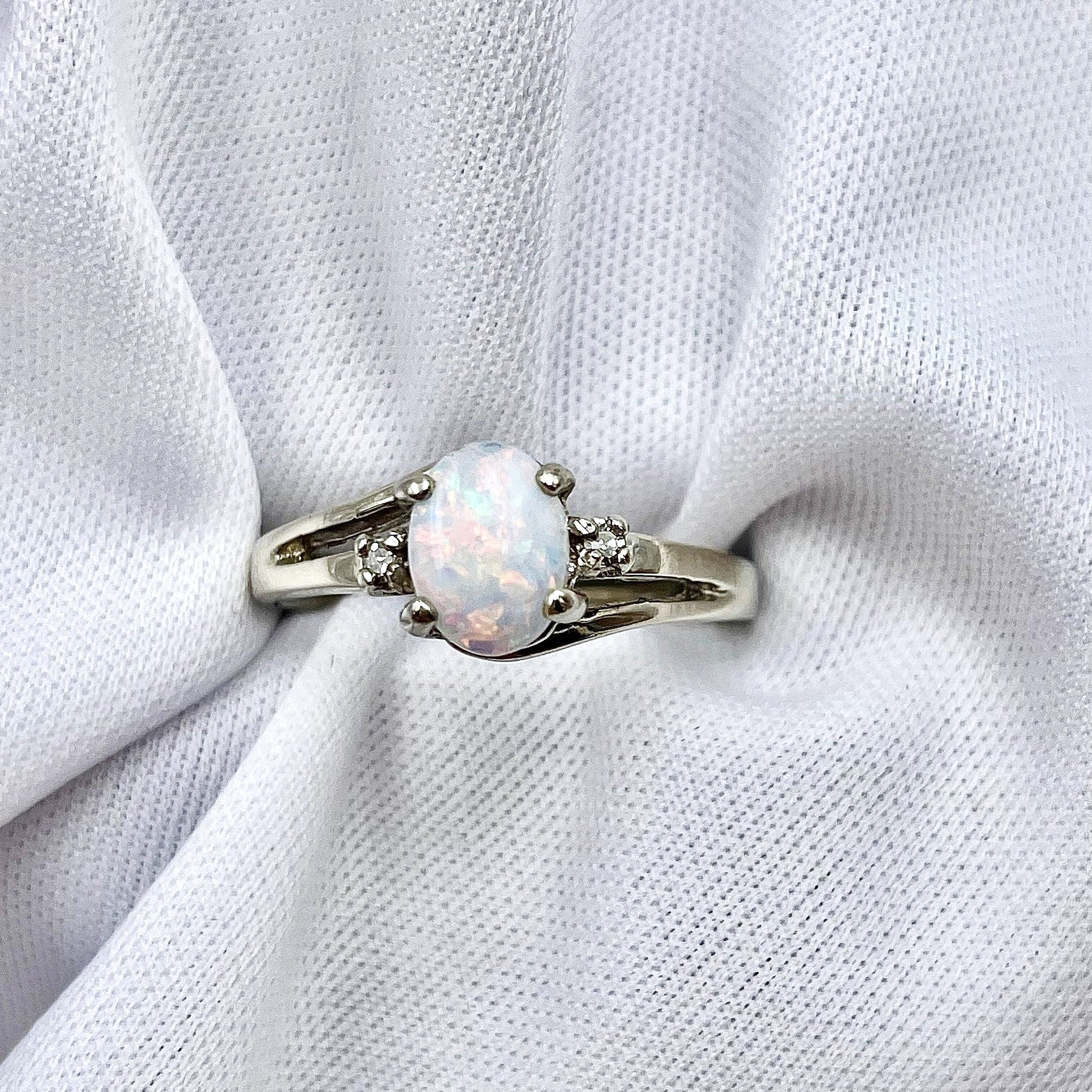 top down view white background 10k White Gold Oval Opal With Diamond Accents Three Stone Ring