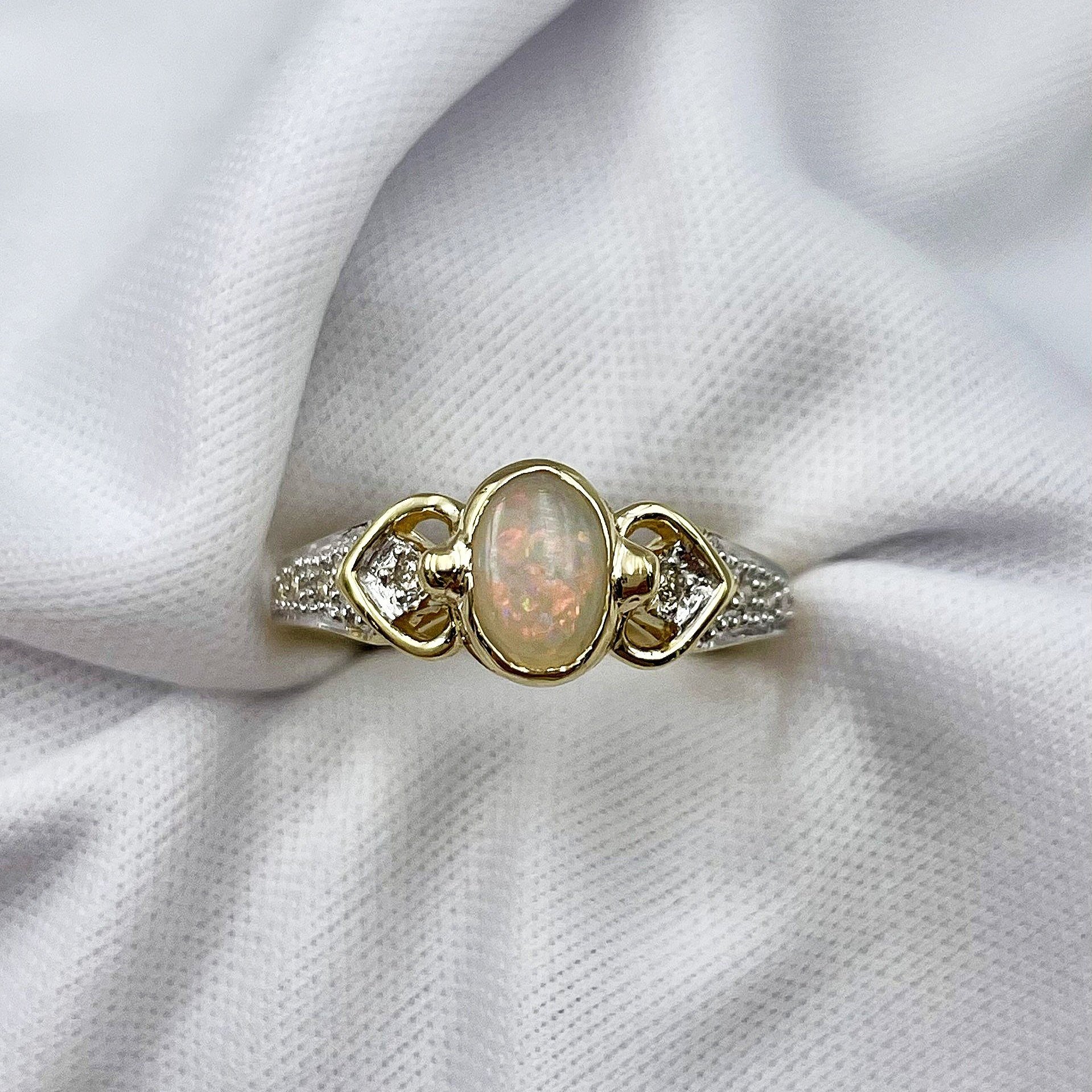 top down view white background 10k Yellow Gold Bezel Set Oval Opal With Diamonds Ladies Ring