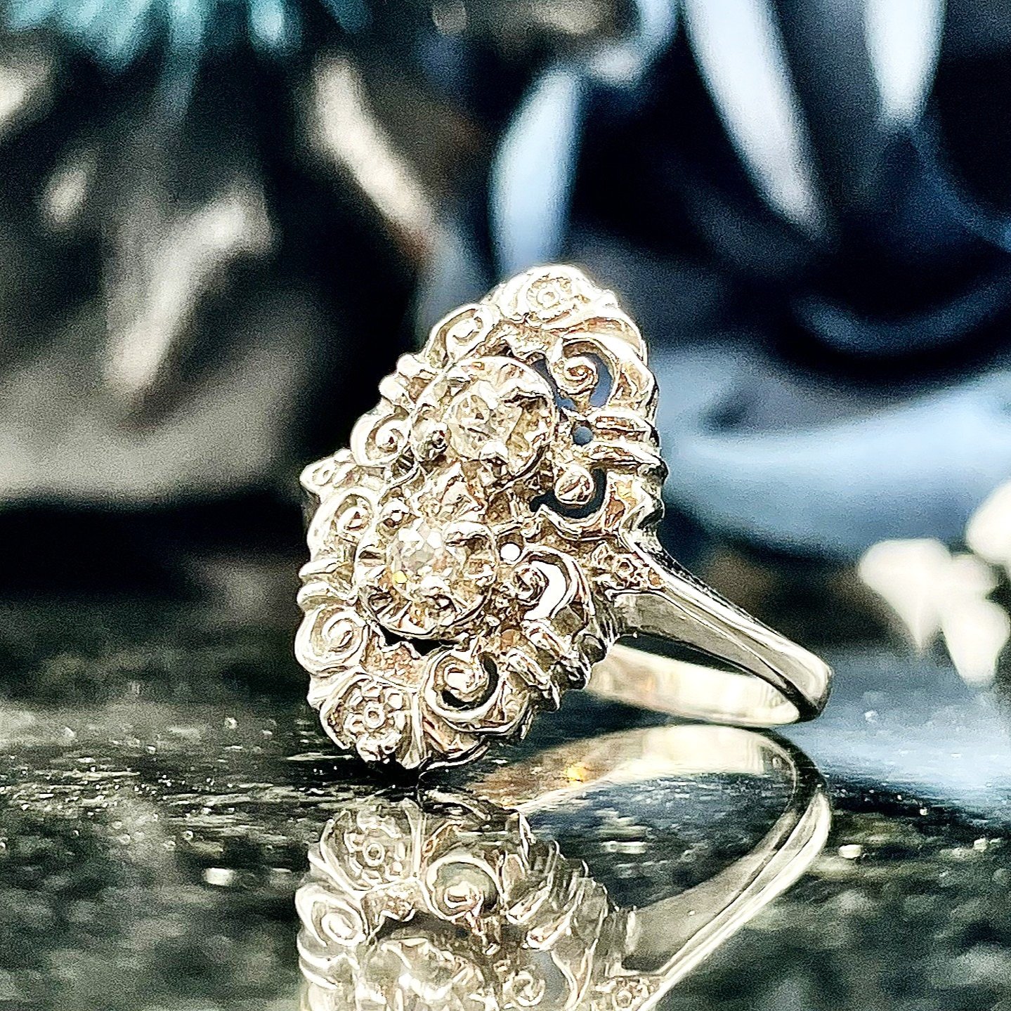 close up in front of flowers Vintage .16ctw Old Mine Cut Estate Diamond Ring 14K White Gold
