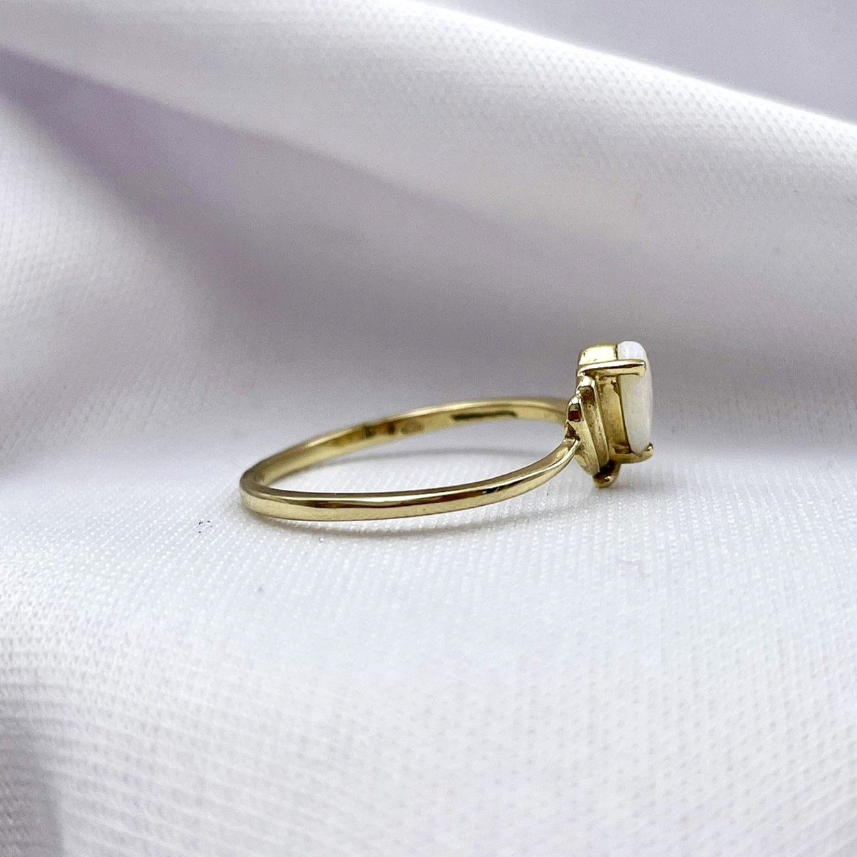 side view white background 10k Yellow Gold Pear Cut Opal With Diamond Accent Ladies Ring