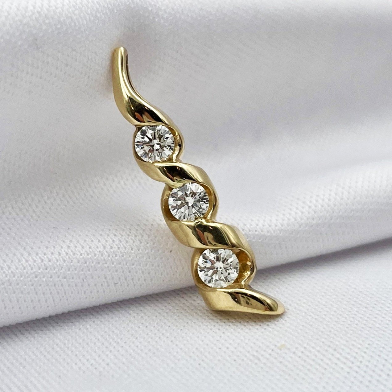 close up white background 1/2ctw A+ Quality Three Stone Diamond Twist Pendant 14k Yellow Gold