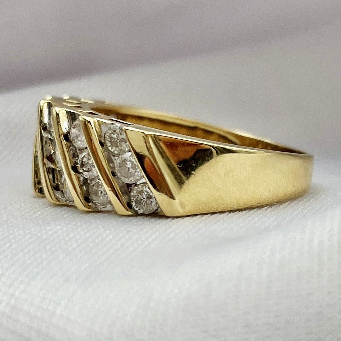 side view white background 1.00ctw A Quality Channel Set Diamond Band 10k Yellow Gold