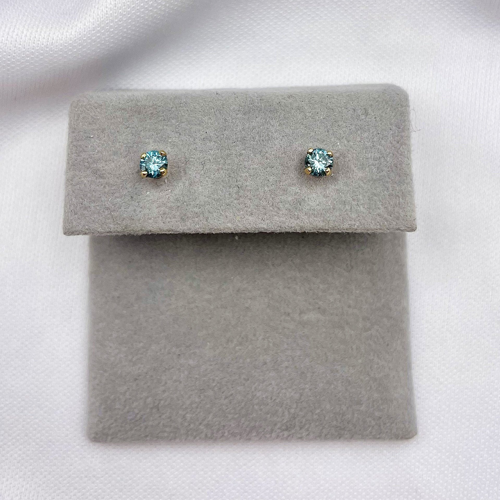 top down view white background .28ctw Treated Blue Diamond Stud Earrings 14k Yellow Gold