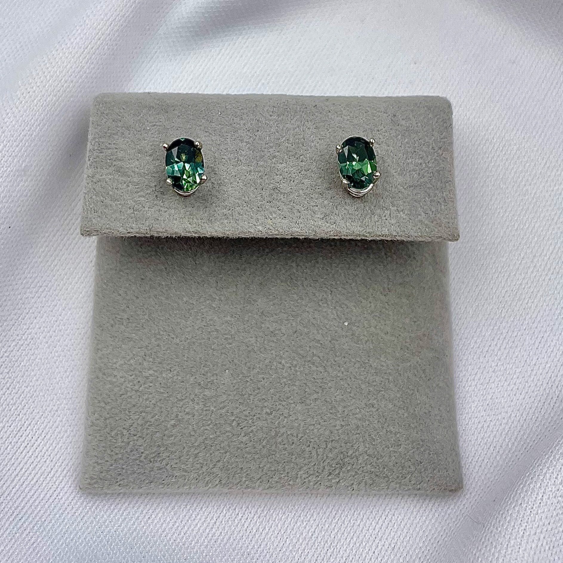 top down view white background 1.06ctw 6x4mm Oval Blue Green Sapphire Solitaire Studs 14k White Gold