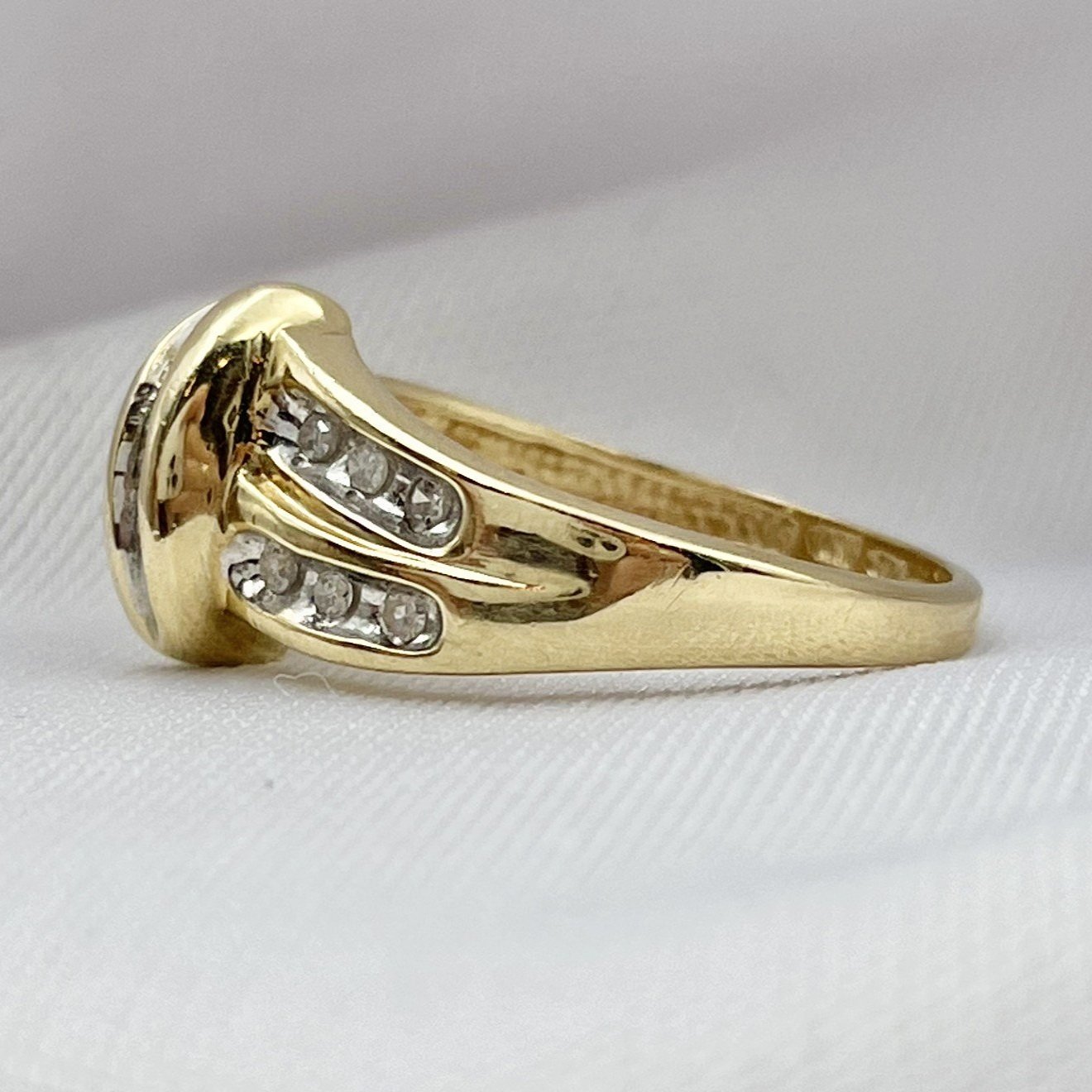 side view white background 10k Yellow Gold Vintage 1/10ctw Diamond Channel Fashion Band