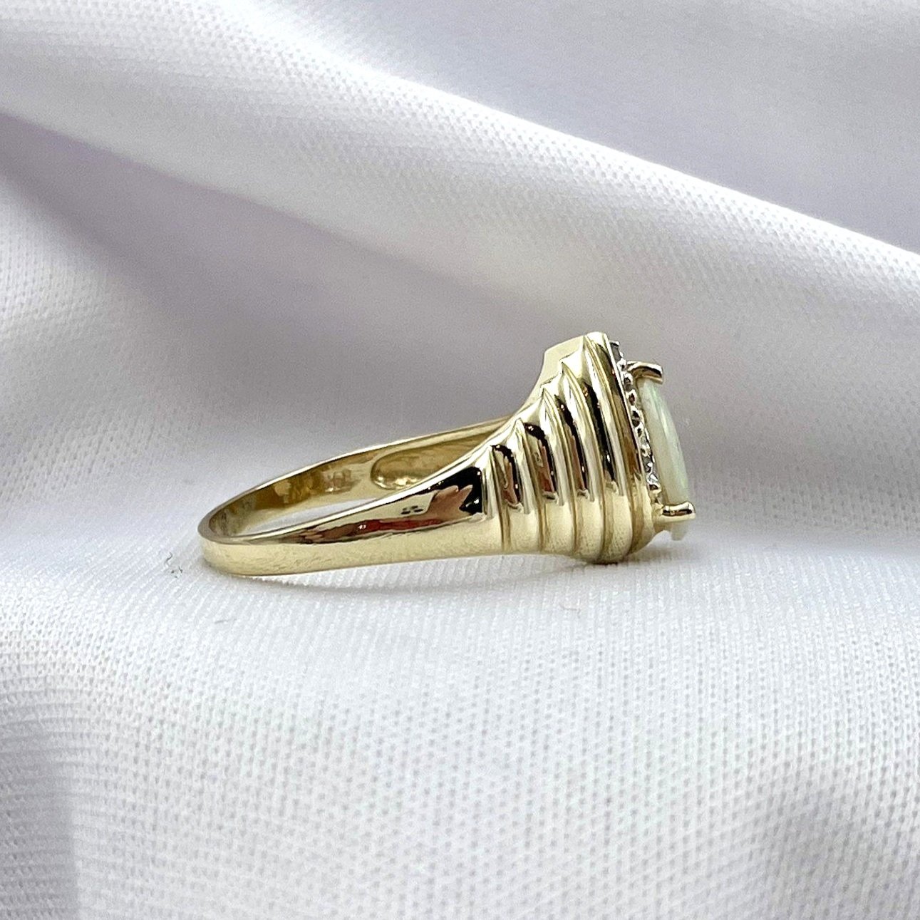 side view white background 14k Yellow Gold Pear Cut Opal With Diamond Accents Ladies Ring