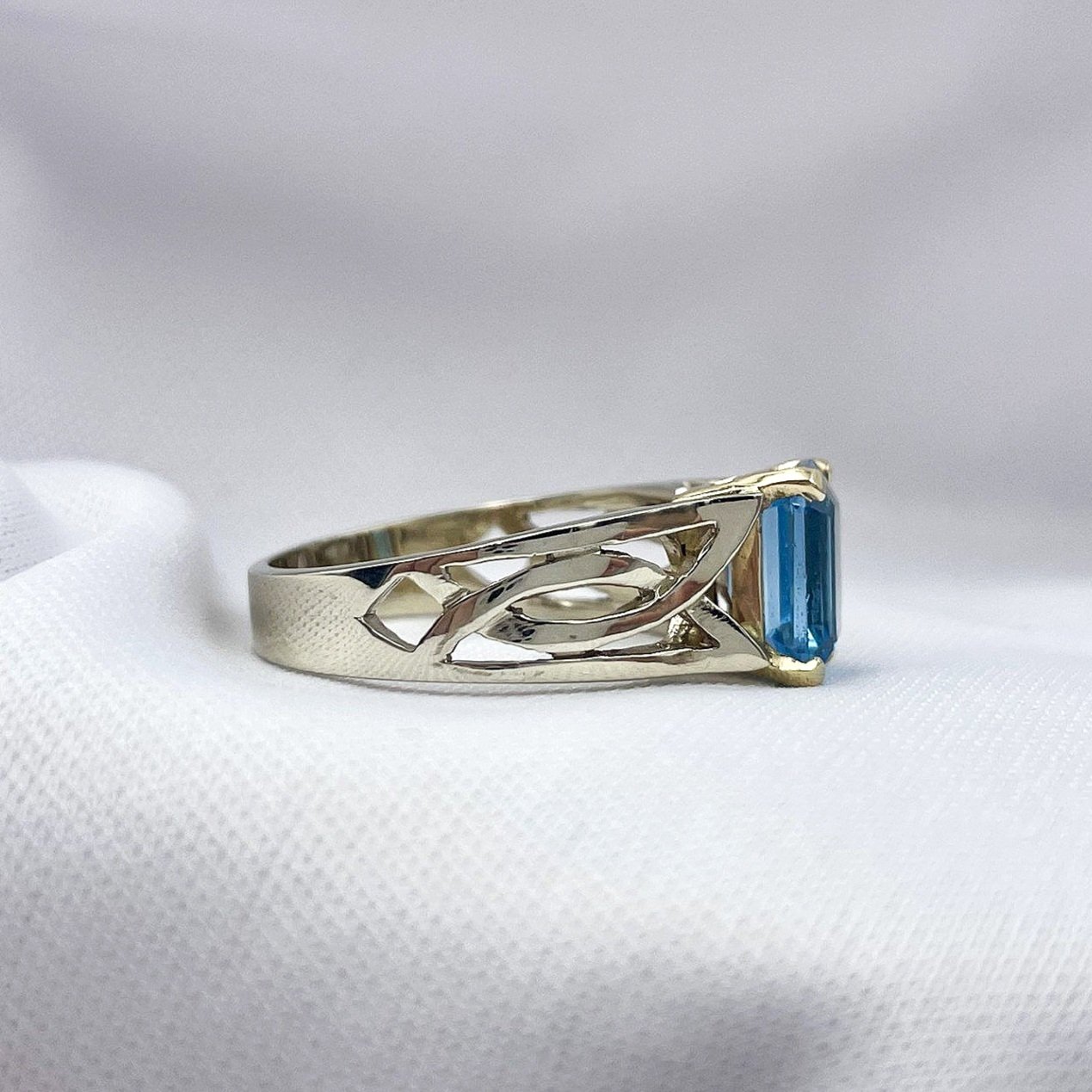 side view white background 14k White Gold Celtic Knot Inspired Blue Topaz Ladies Ring